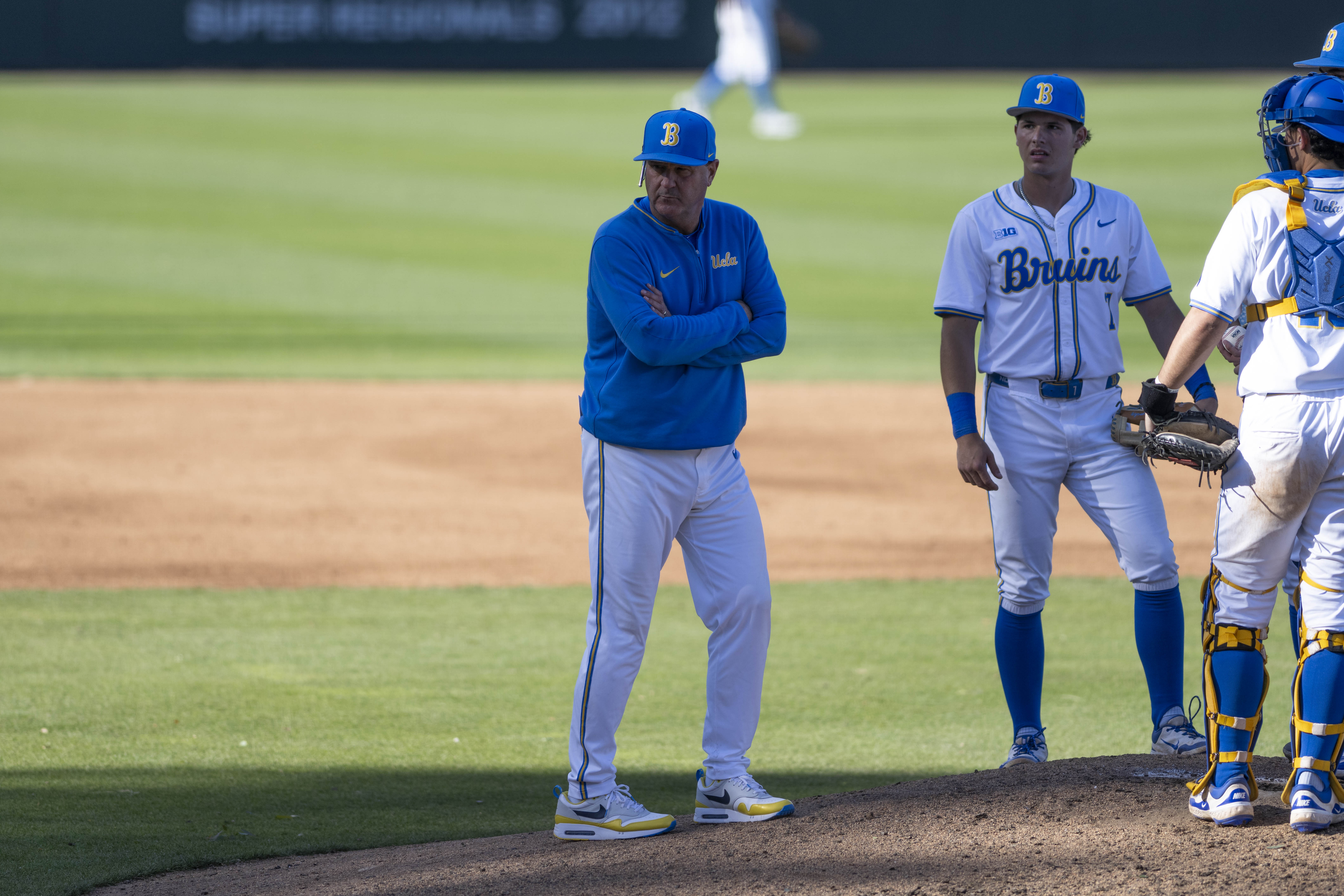 UCLA baseball coach John Savage looks towards home plate as he makes a mound visit. The coach is in his 21st season at the Bruins' helm. (Aidan Sun/Assistant Photo editor)