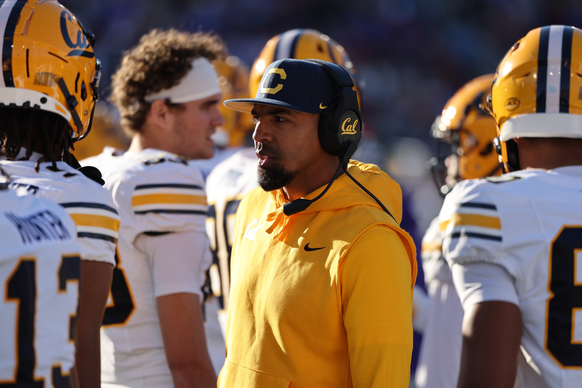 Wide receivers coach Burl Toler III talks to his players on the sideline against Southern Methodist on Nov. 30. Toler was also hired as passing game coordinator and recruiting coordinator for the Bruins, and he brought Matthews with him upon his move to UCLA. (Courtesy of Cal Athletics)