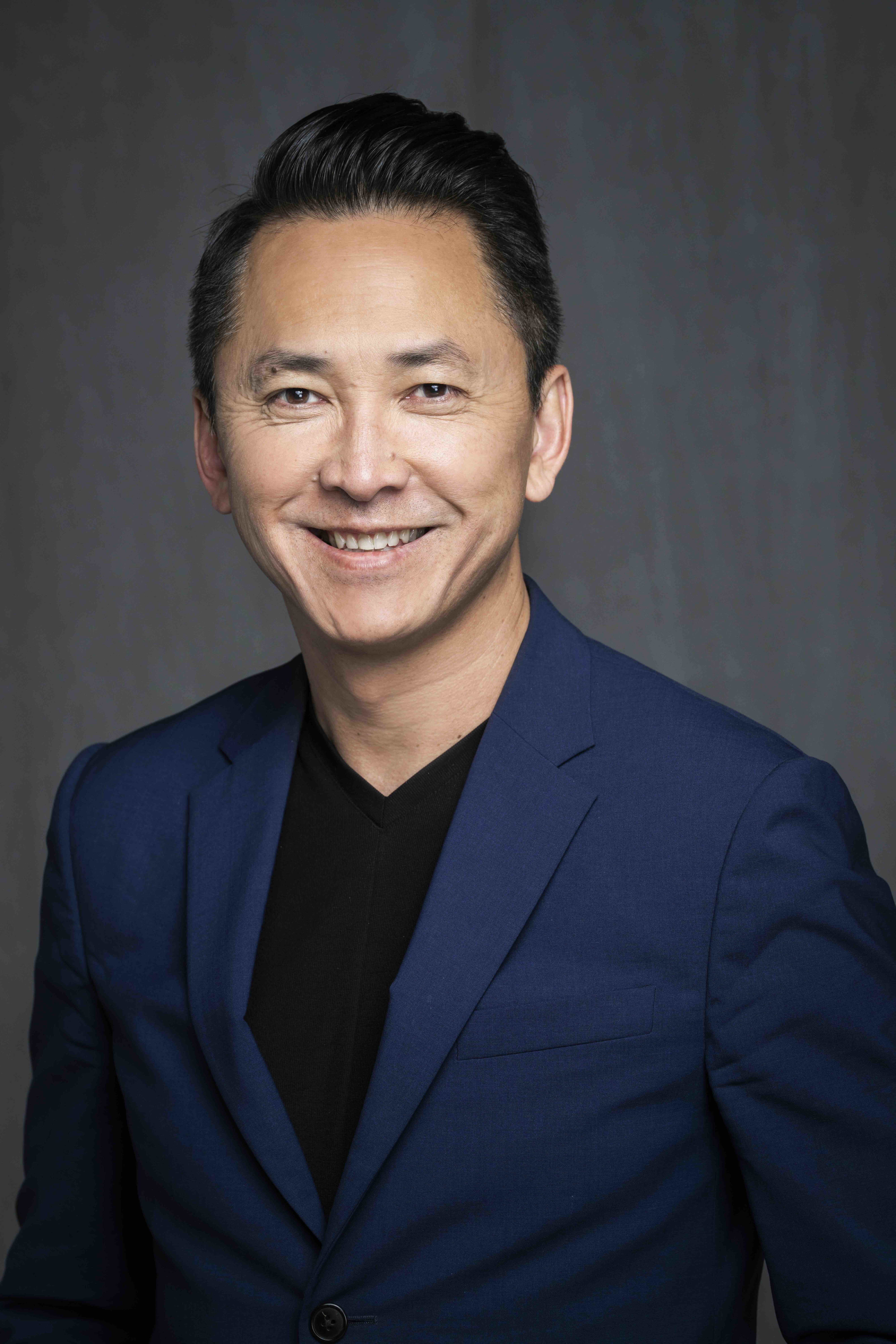Pictured is Viet Thanh Nguyen in a blue blazer and a black shirt, posing for his headshot. The Pulitzer Prize winner and author of “To Save and to Destroy,” discussed the role of storytelling in shaping one’s identity at the LA Times FOB.(Courtesy of Viet Thanh Nguyen)