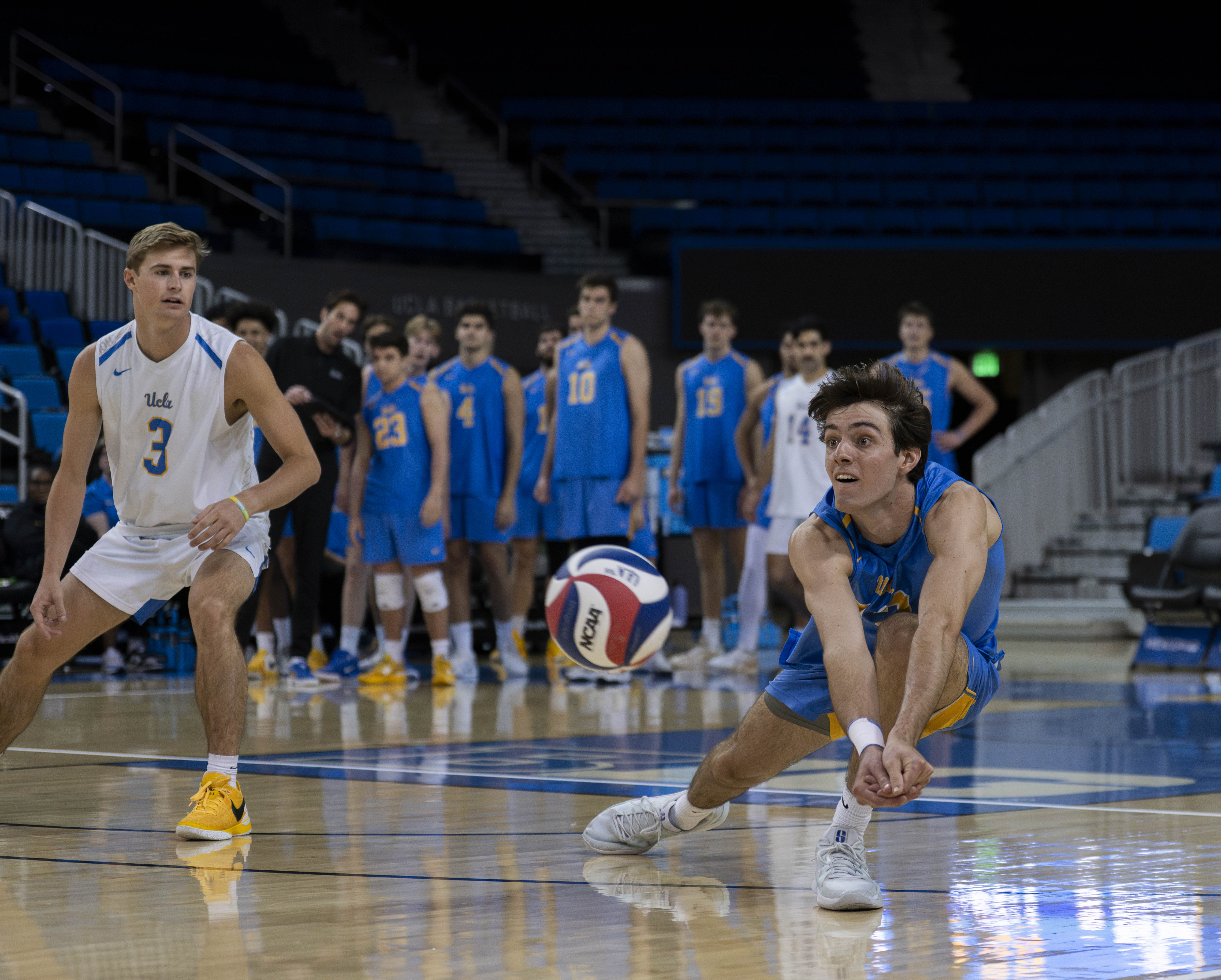 Freshman outside hitter Sean Kelly dives forward to dig the ball. (Zimo Li/Photo editor)