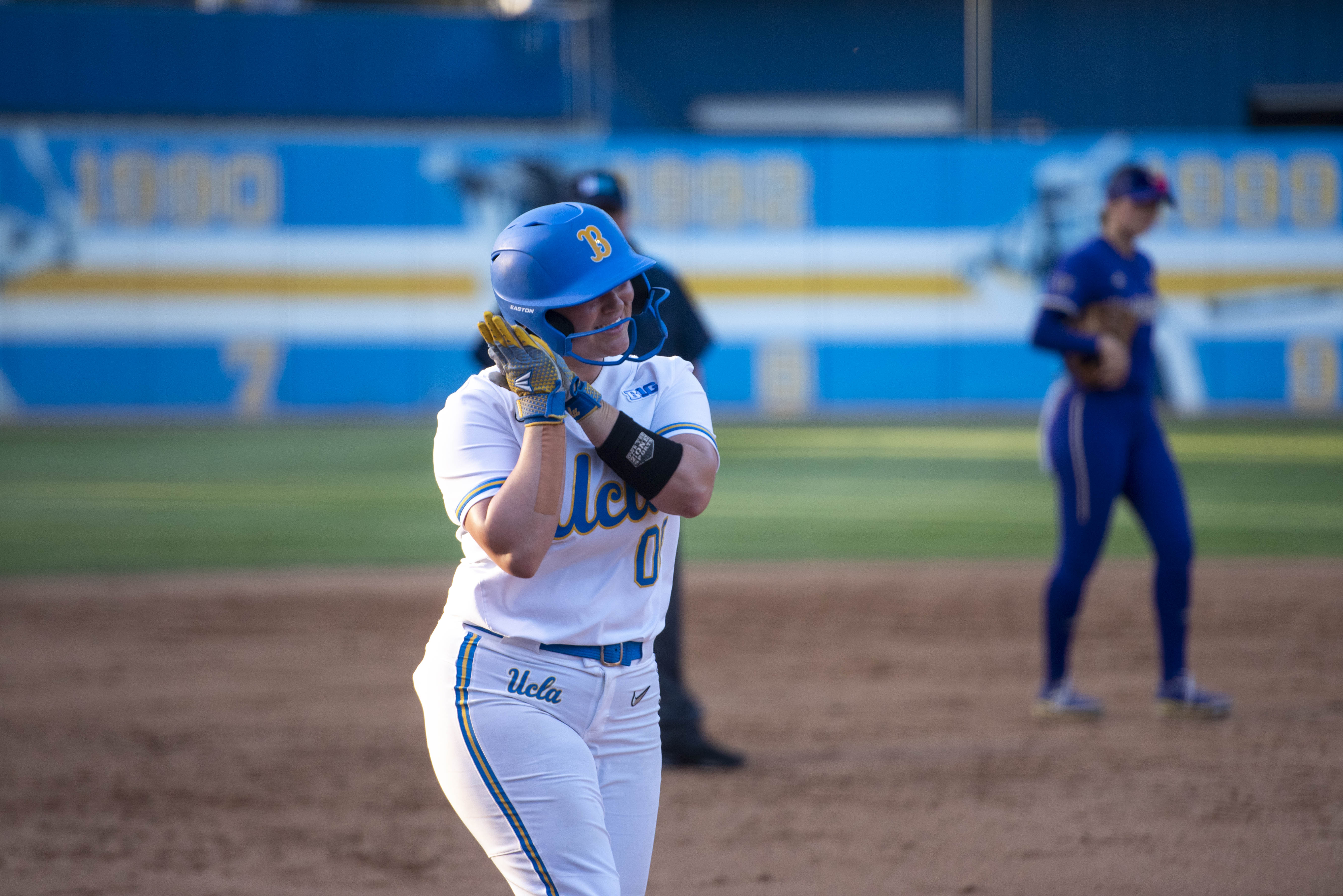 Freshman catcher/designated player Sofia Mujica rounds third base while celebrating a home run. (Danielle Anz/Daily Bruin senior staff)
