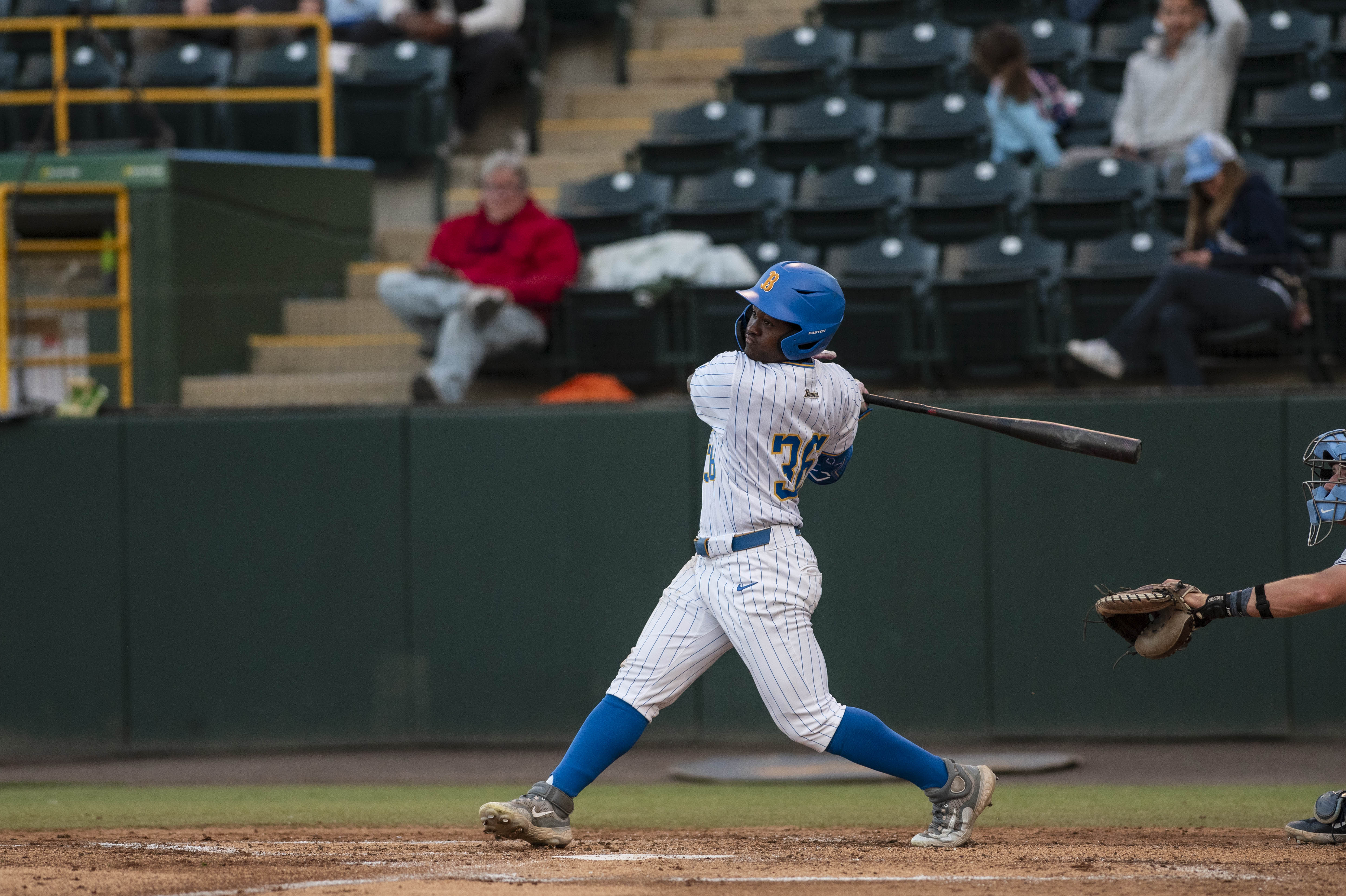 Sophomore left fielder Dean West follows through on his swing. West recorded his fifth three-hit game of the season Friday. (Bettina Wu/Daily Bruin senior staff)