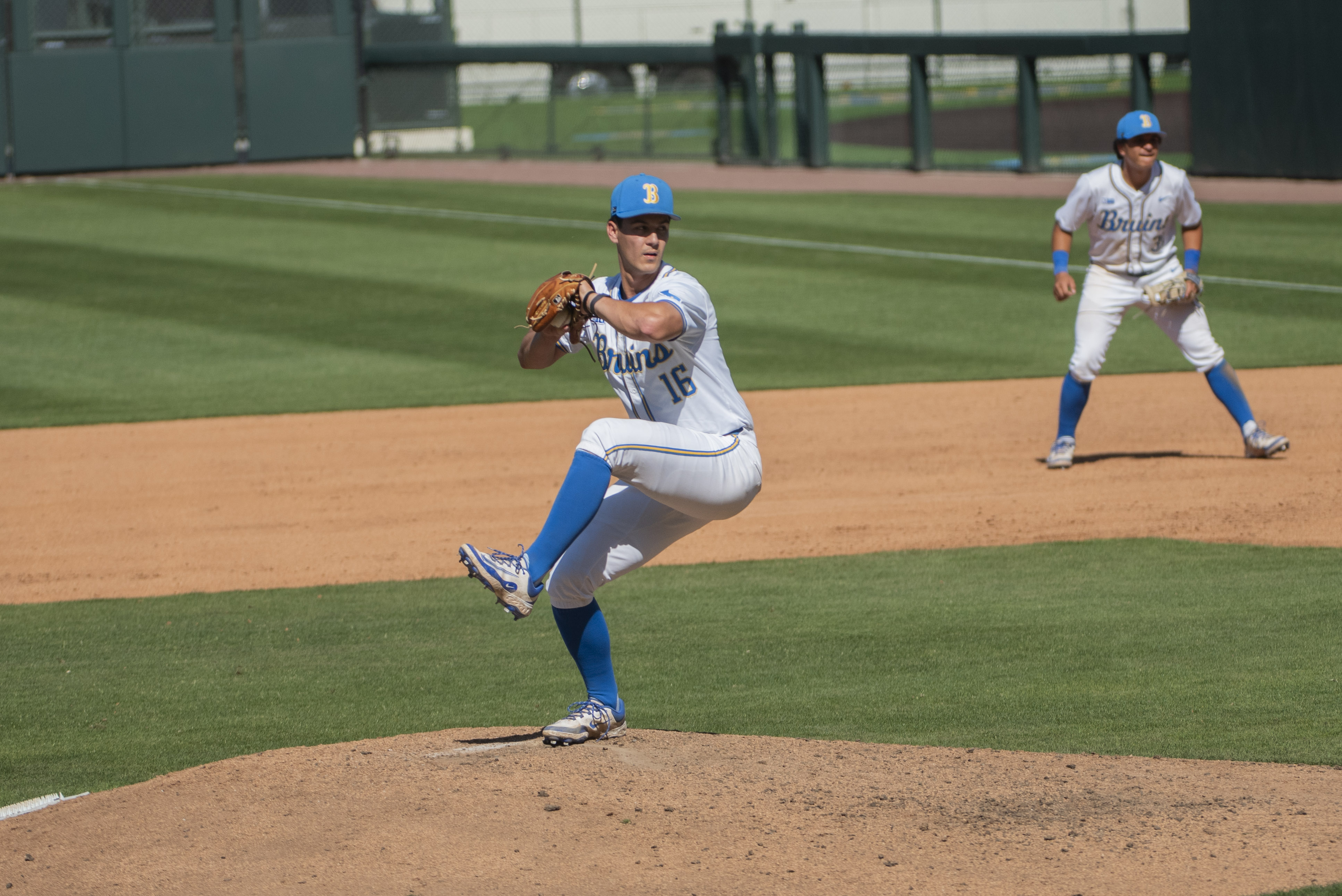 Junior right-hander Jack O’Connor begins his delivery towards the plate. Similar to Alger, injuries kept O’Connor from making an impact on the field throughout his first two seasons as a Bruin. But he finally made his collegiate debut, pitching Feb. 14 against Cal Poly. (Max Zhang/Daily Bruin)