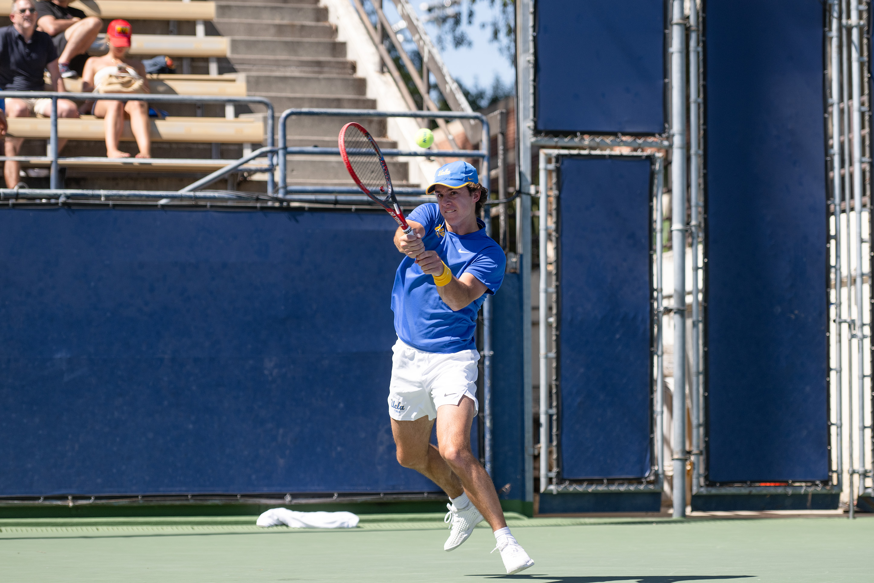 Freshman Kaylan Bigun follows through on a backhand. (Brianna Carlson/Daily Bruin staff)