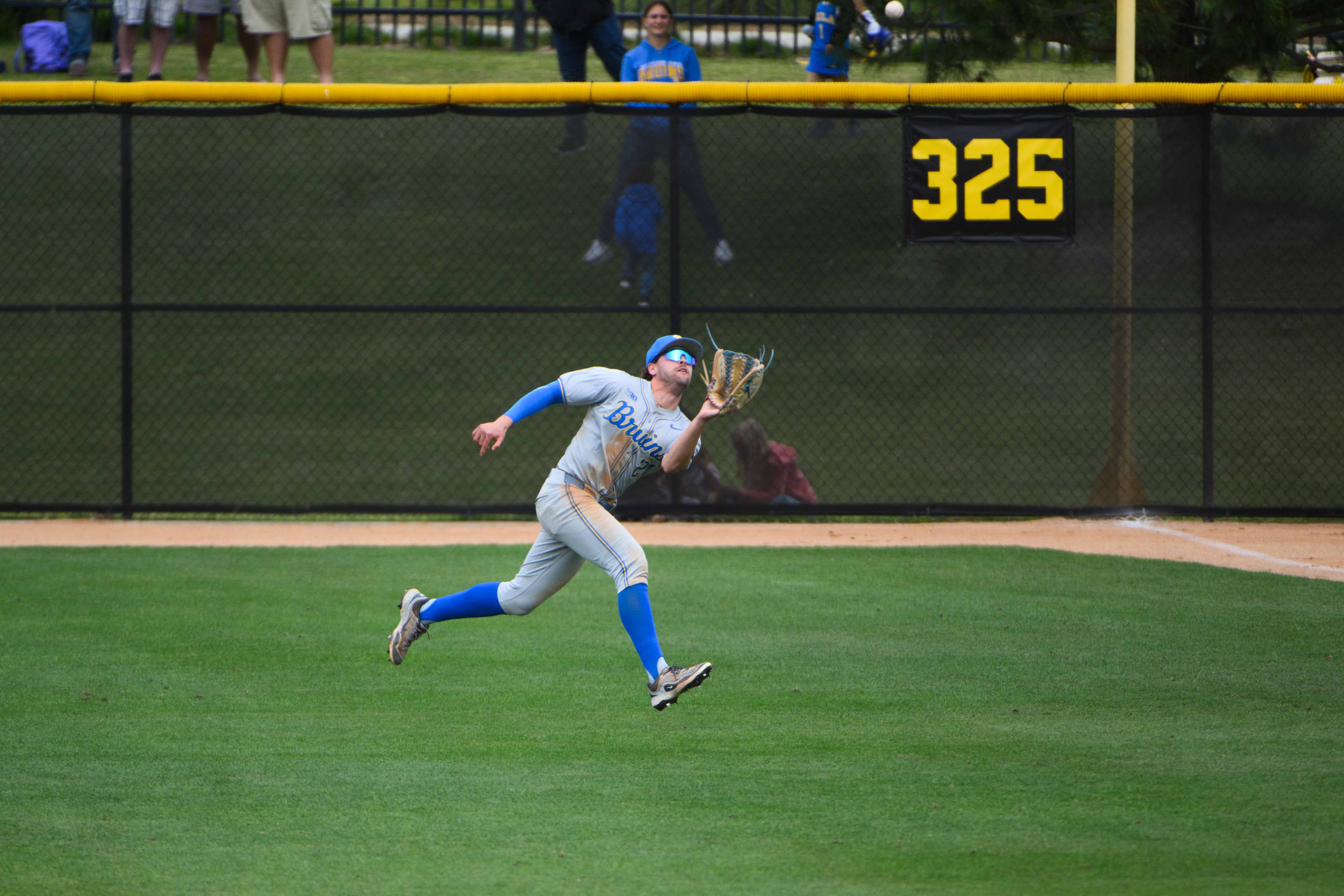 Redshirt senior outfielder AJ Salgado tracks down a flyball in right field. (Jeannie Kim/Daily Bruin senior staff)