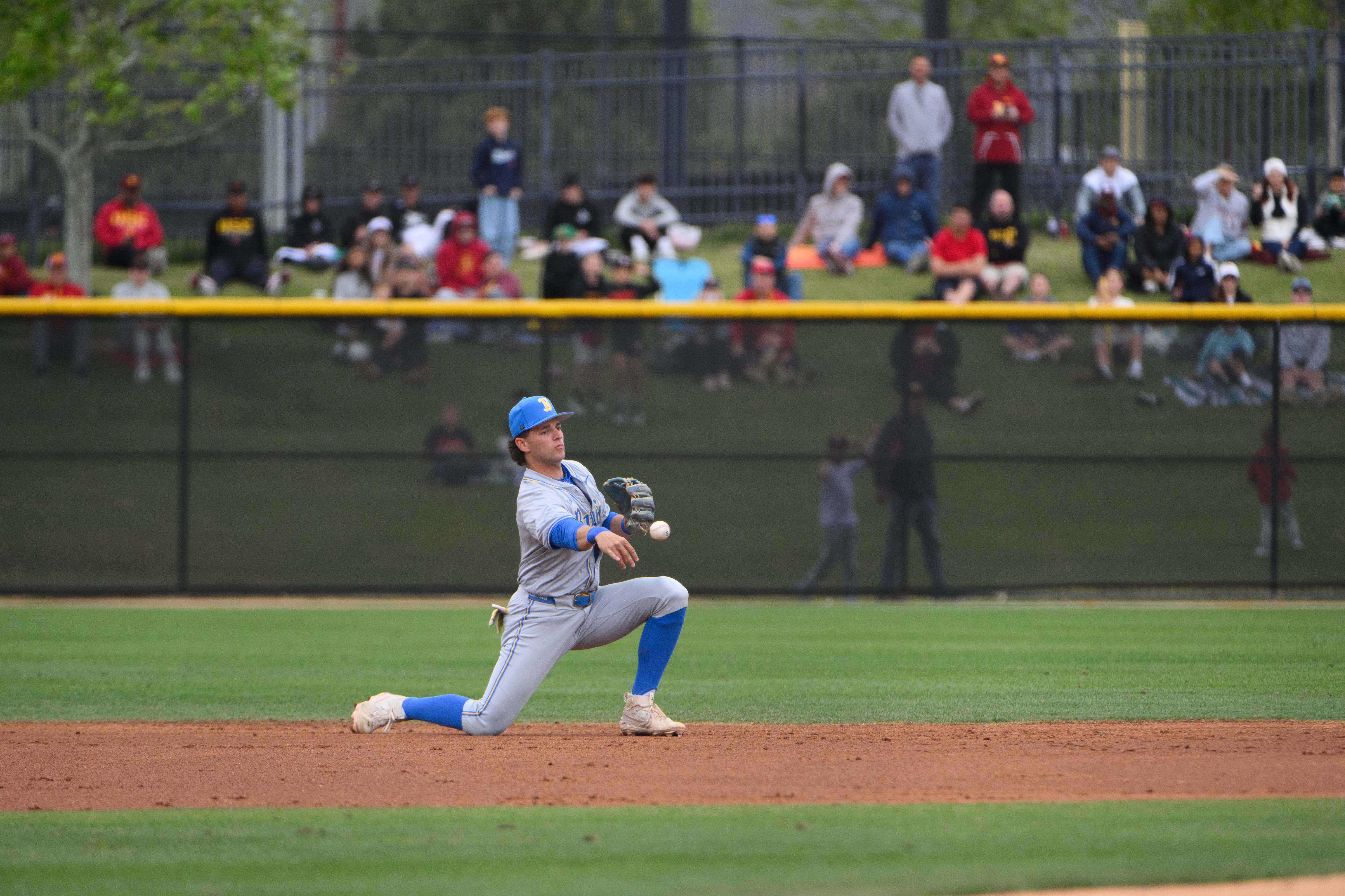 Sophomore shortstop Roch Cholowsky tosses towards second base. (Jeannie Kim/Daily Bruin senior staff)