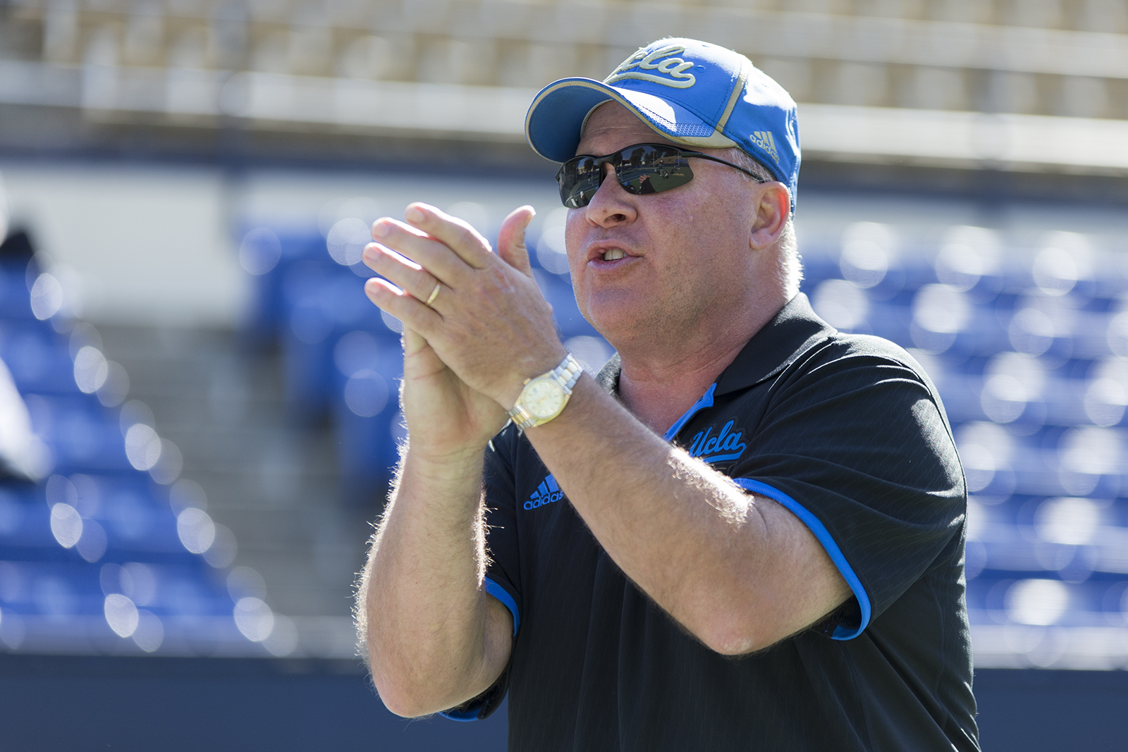 Coach Billy Martin claps his hands at the Los Angeles Tennis Center. (Daily Bruin file photo)