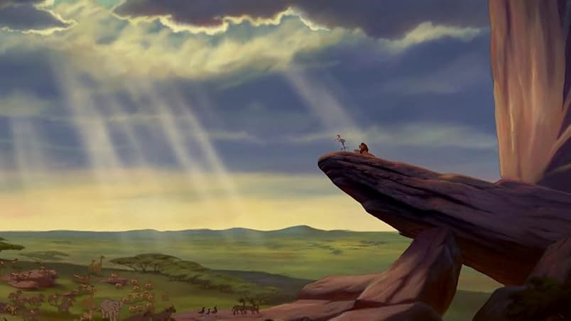 A scene from Disney&squot;s 1994 animated film "The Lion King" depicts a variety of animals on the Tanzanian savanna looking up toward Pride Rock. Grammy winner Elton John contributed to the film&squot;s soundtrack, which includes the opening number "Circle of Life." (Courtesy of IMDb and Walt Disney Animation Studios)