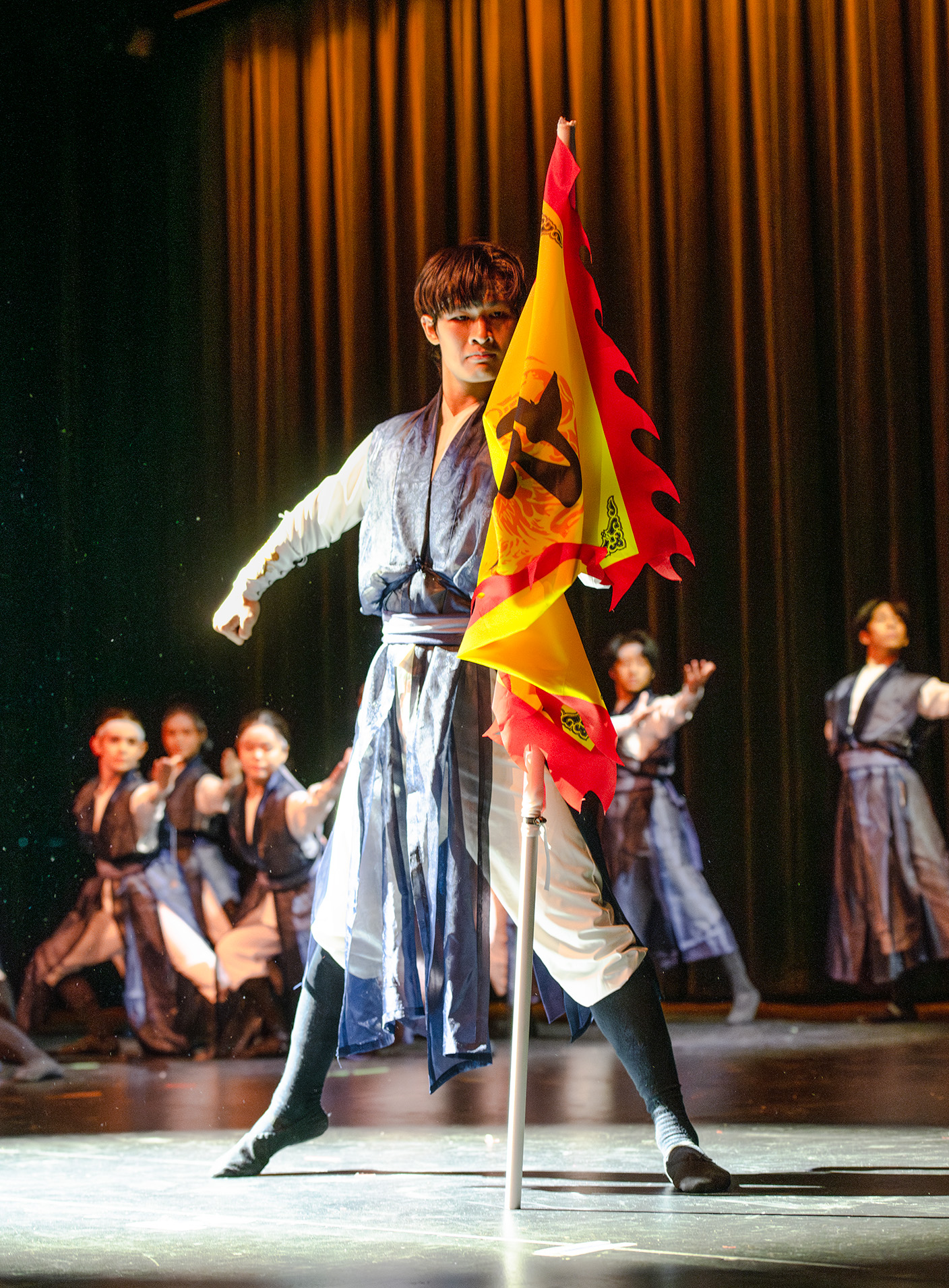 Members of the Chinese Cultural Dance Club wear blue, white and black ensembles during a performance of a routine called "Whispers of the Wind" at Schoenberg Hall on Saturday. The dance sequence was one of eight choreographed pieces showcased at the club&squot;s Lotus Steps year-end event. (Selin Filiz/Daily Bruin staff)