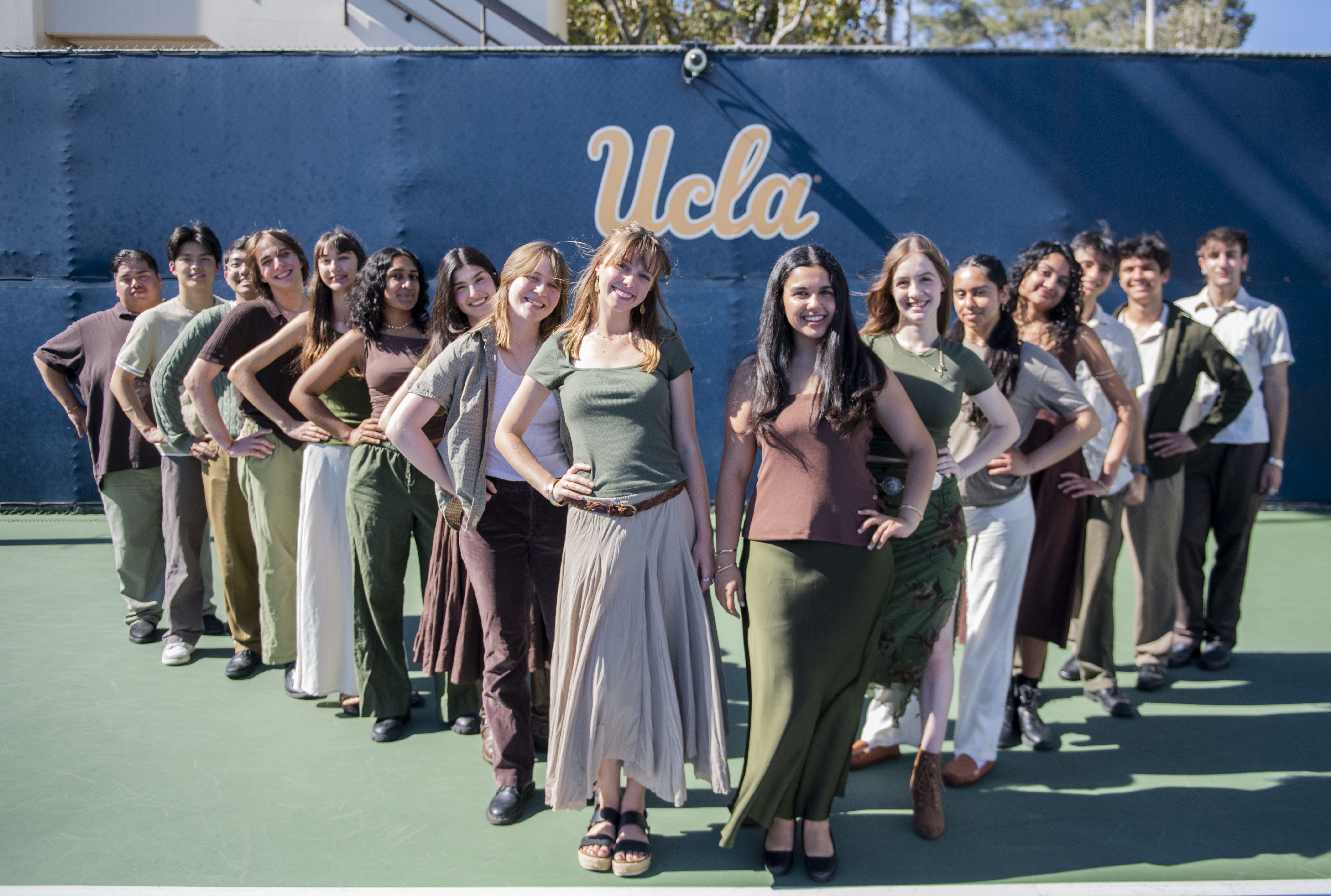 Members of the student a cappella group Awaken A Cappella stand together for a photo in a V-shaped formation, with most members putting a hand on their hip. The group will perform a rendition of Olivia Rodrigo&squot;s "the grudge" at Spring Sing on Friday. (Karla Cardenas-Felipe/Daily Bruin staff)