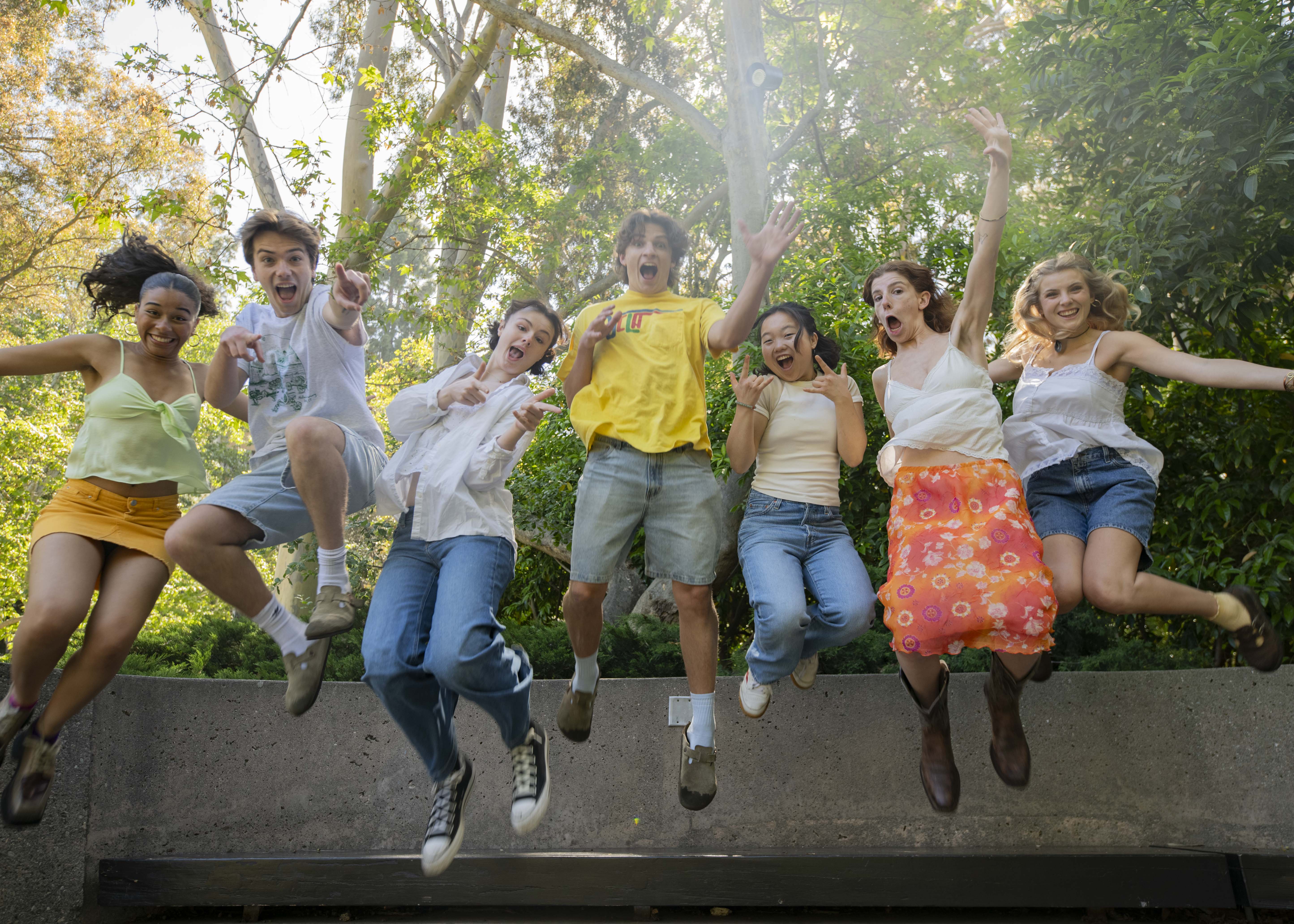 Members of Company pose for a picture while jumping up off the ground simultaneously. Fourth-year global jazz studies student and Company member Ellie Rice said about half of the sketches for Friday are pre-recorded and the other half will be performed live. (Isabella Appell/Daily Bruin)