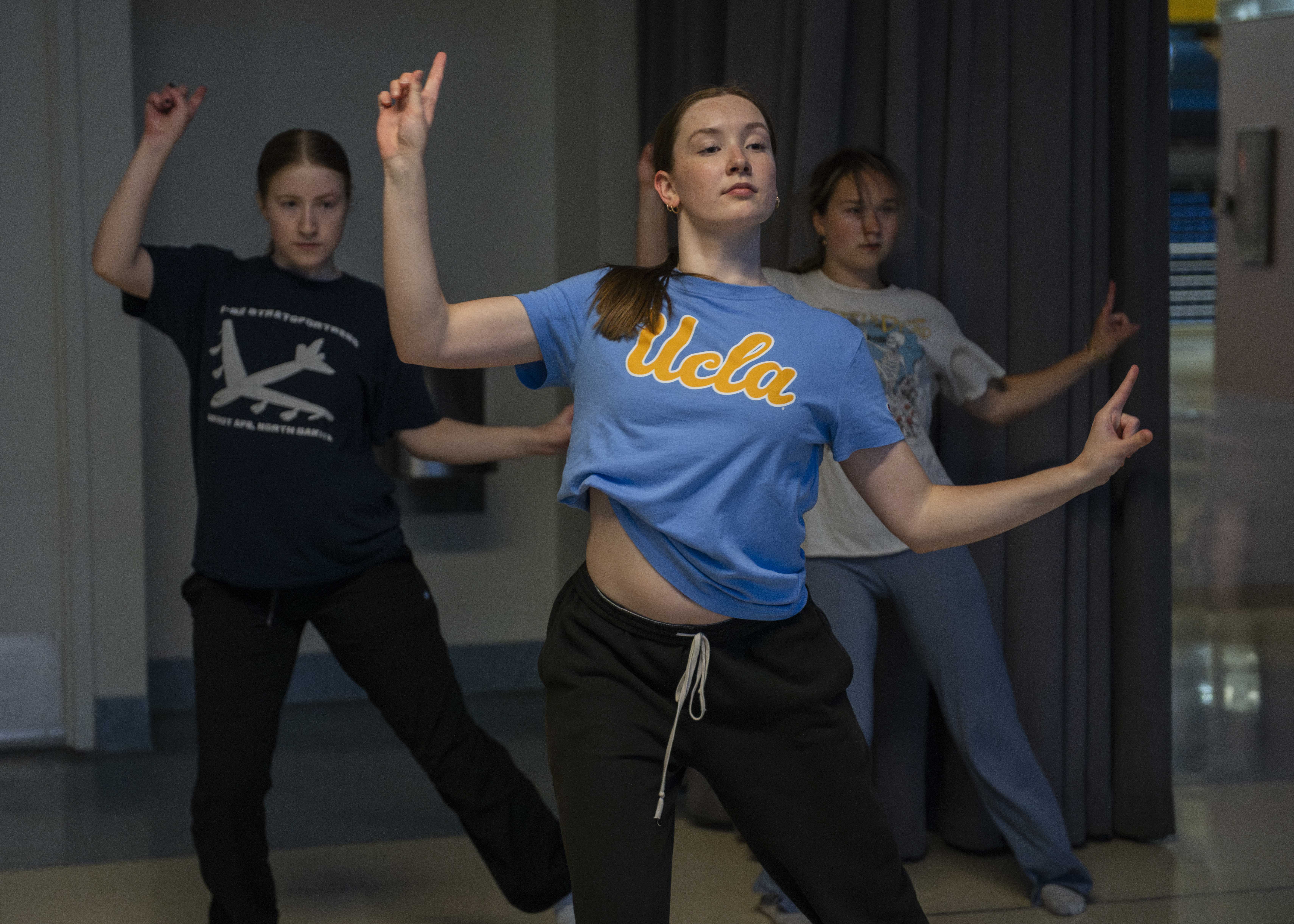Icarus Contemporary members Bailey Cowley (left), Addison Scully (center) and Emerson Howard (right) practice a dance routine together. The team&squot;s performance at Spring Sing will be soundtracked by songs such as "Temperature" by Sean Paul and “You Make Me Feel...” by Cobra Starship featuring Sabi. (Anna Dai-Liu/Daily Bruin senior staff)