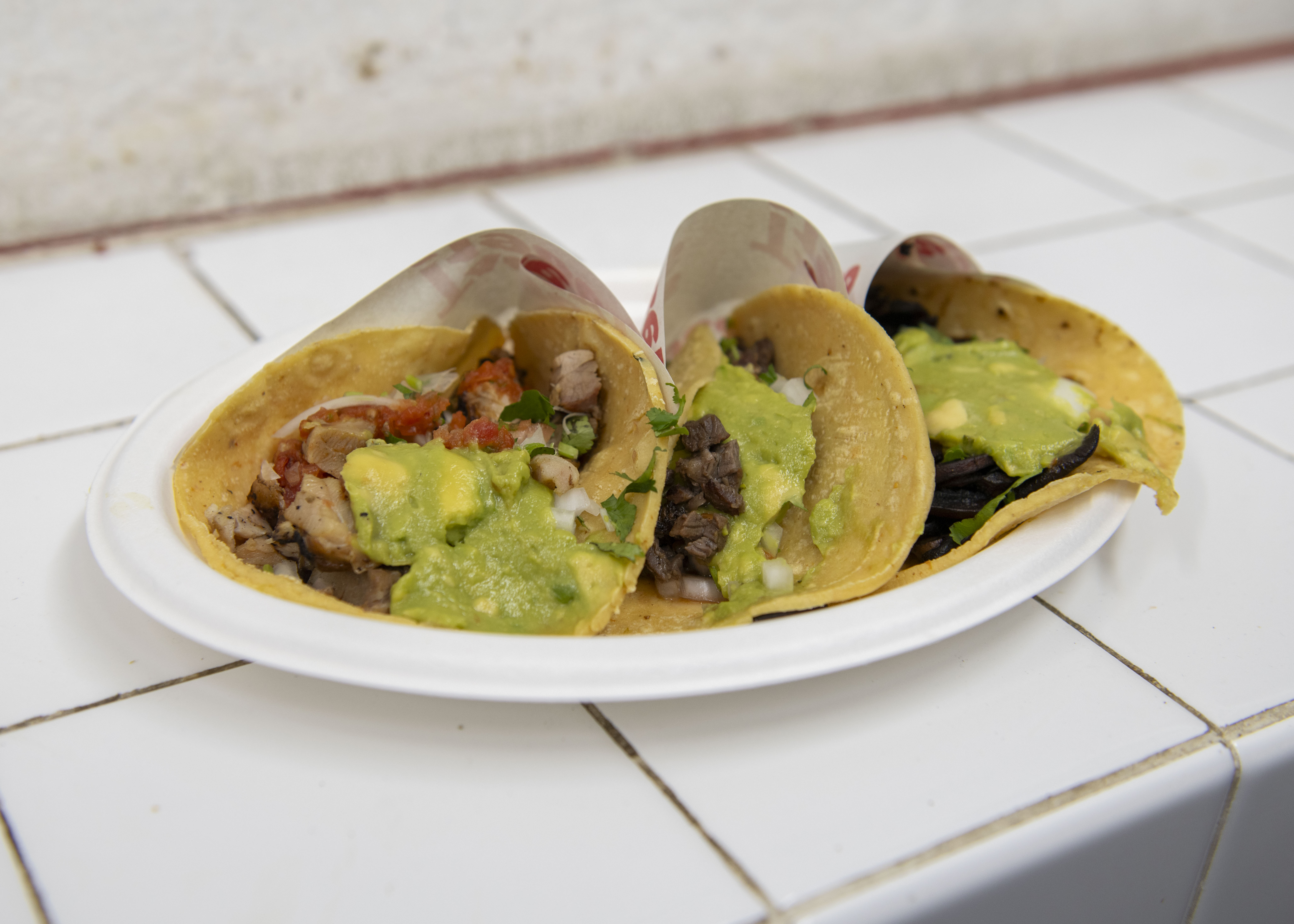 Pictured is a three-taco plate from Tacos 1986 in Westwood. The restaurant serves Tijuana-style tacos. (Ruby Galbraith/Daily Bruin)