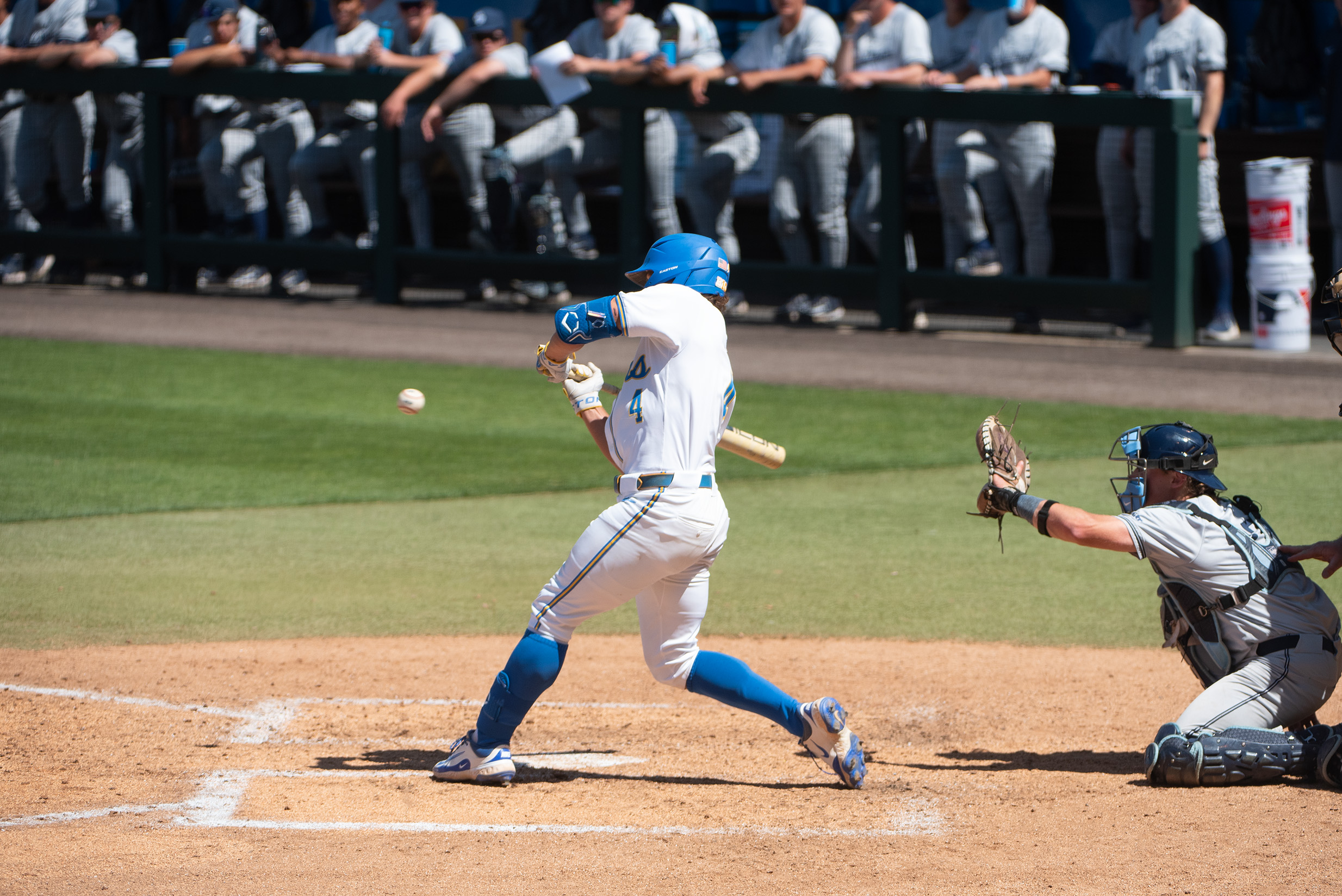 Sophomore second baseman Phoenix Call swings at a top-of-the-zone pitch. (Max Zhang/Daily Bruin)