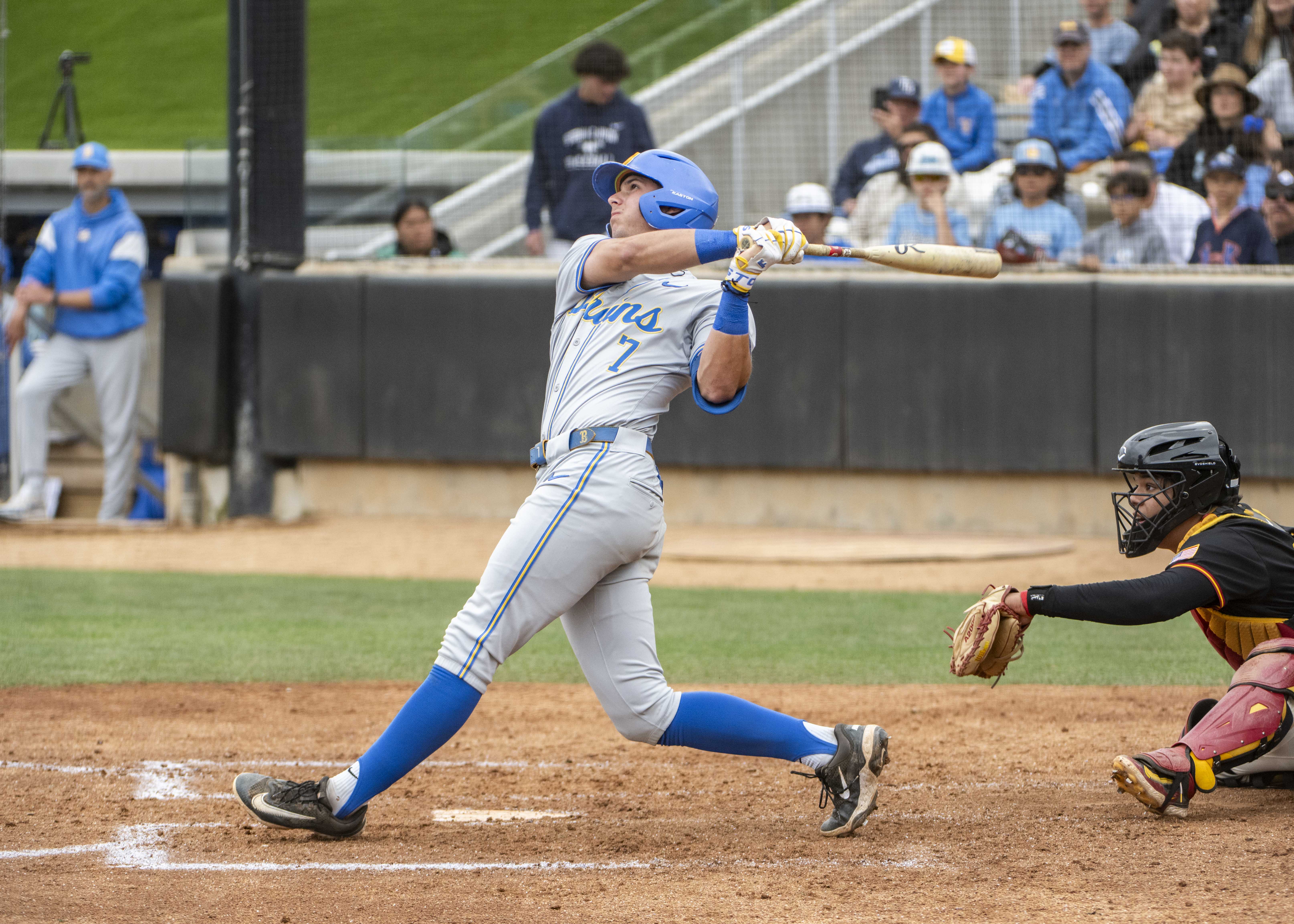 Sophomore third baseman Roman Martin follows a pitch with his eyes after making contact. (Jeannie Kim/Daily Bruin senior staff)