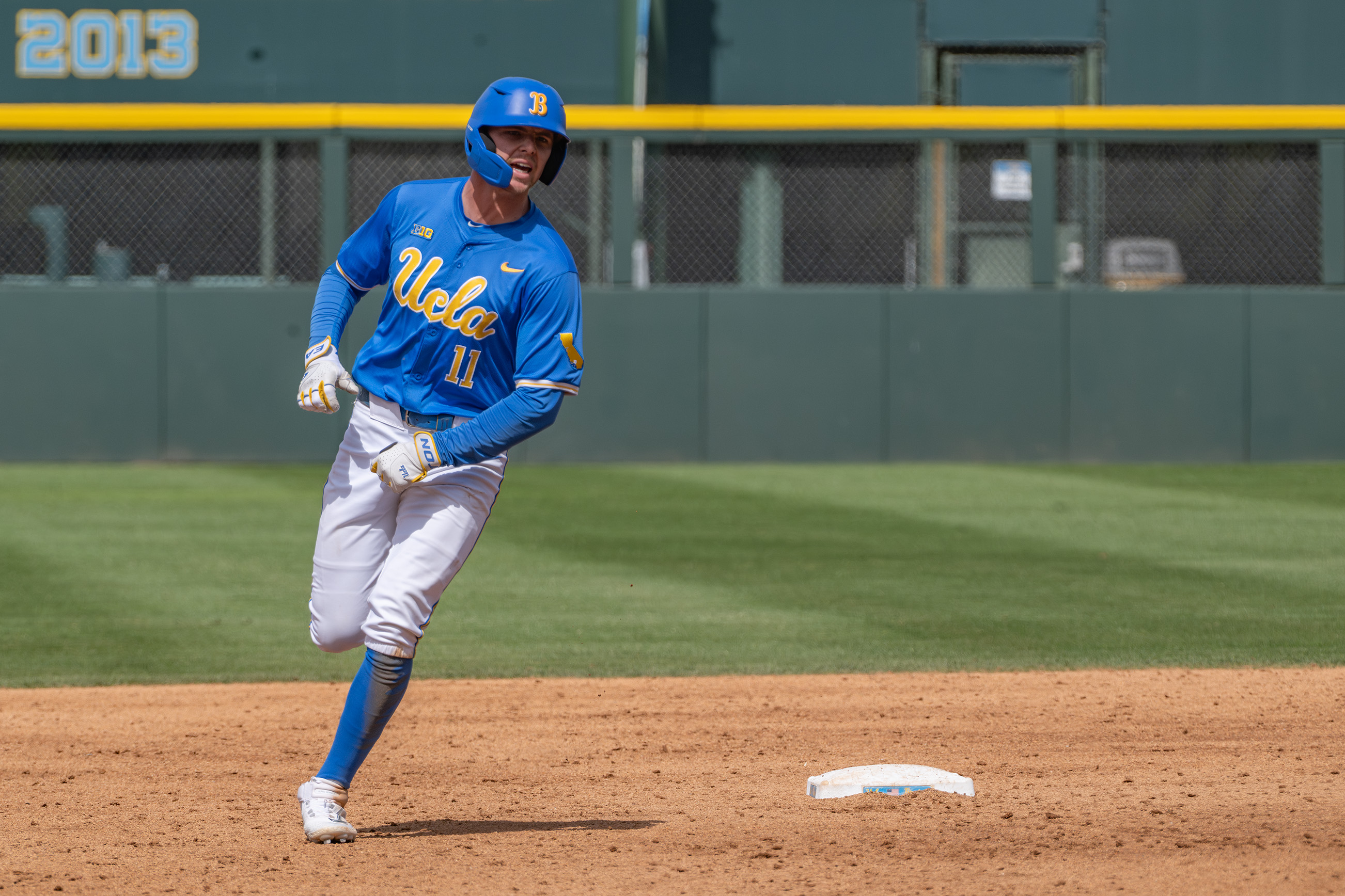 Redshirt sophomore center fielder Payton Brennan rounds second base. (Rohan Ramalingam/Daily Bruin)