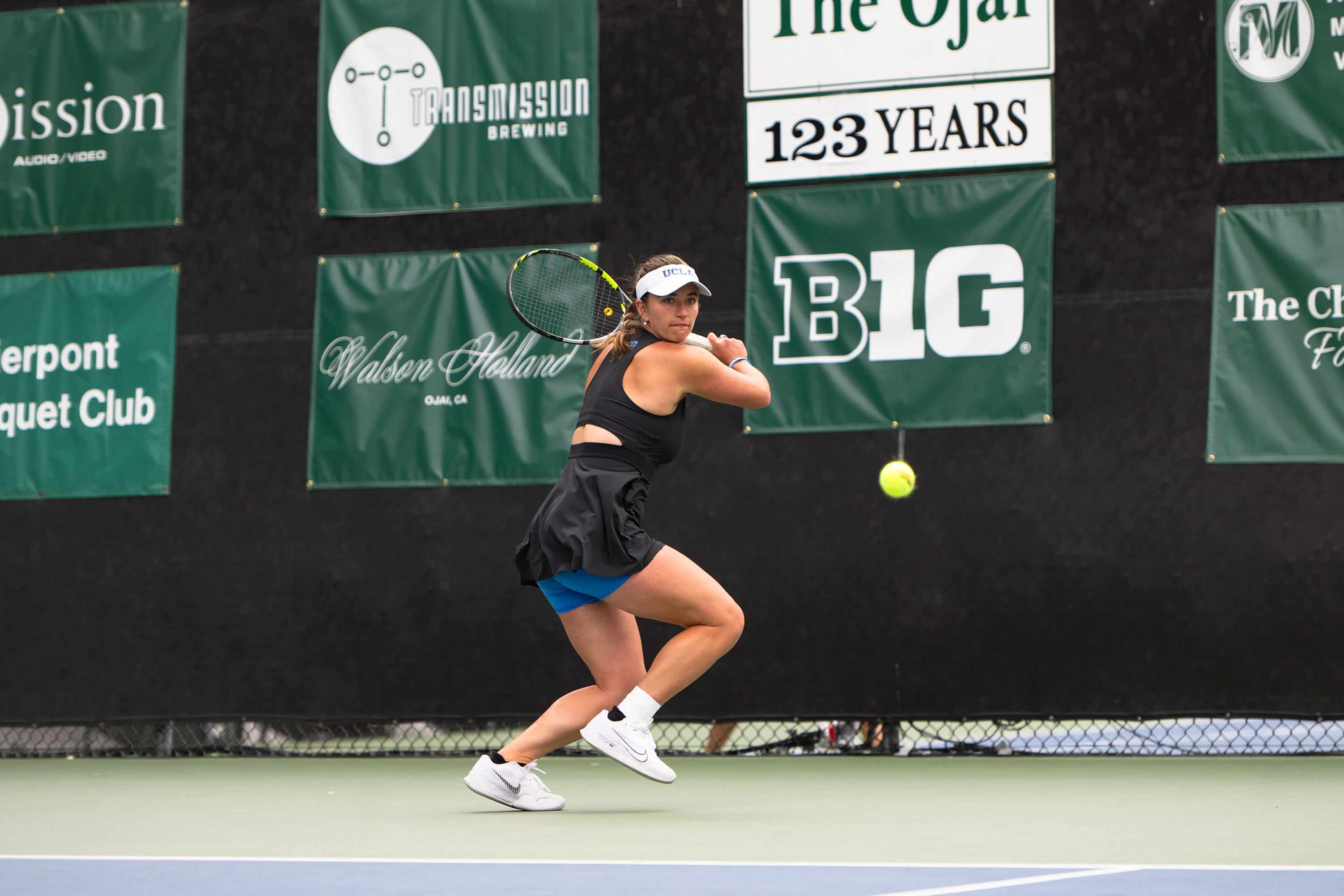 No. 93 senior Kimmi Hance readies before a backhand return. (Brianna Carlson/Daily Bruin staff)