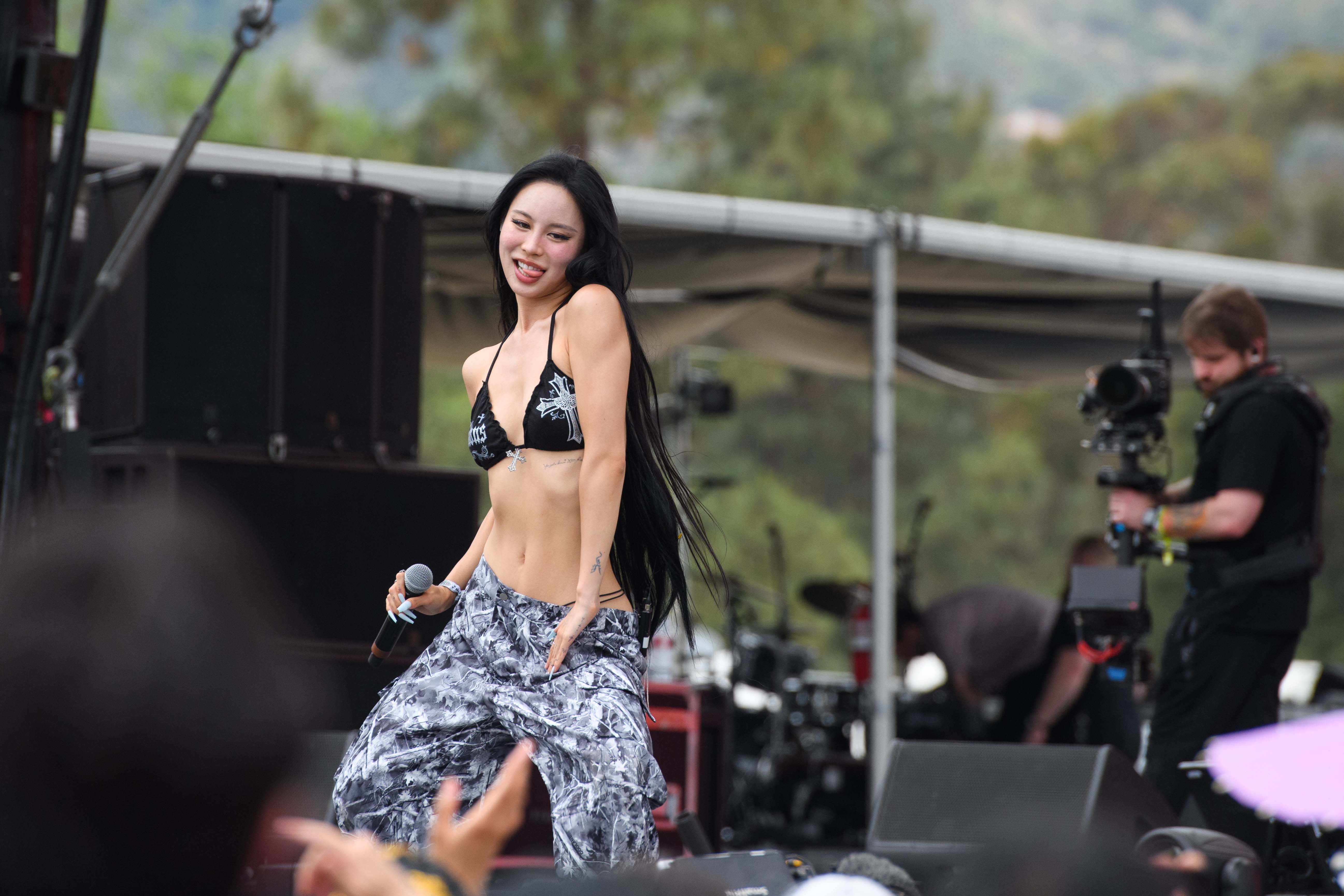 YOUHA dances onstage while performing at the 2025 Head in the Clouds Music & Arts Festival in Pasadena on Sunday. The singer-songwriter released her track "skippy" with yy last month. (Max Zhang/Daily Bruin)