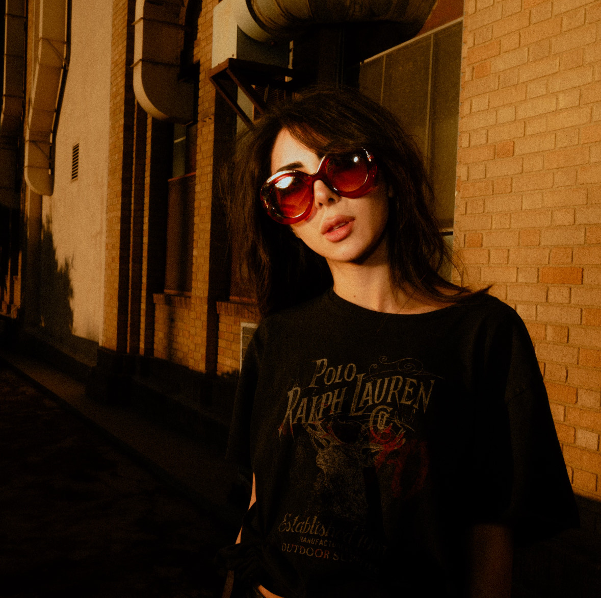 Standing for a photo is Marcy, with her head tilted to the side, as the sun shines over her face and the background. The student said her music is greatly influenced by artists such as Radiohead, Beach House and Tami. (Courtesy of August Suchecki)