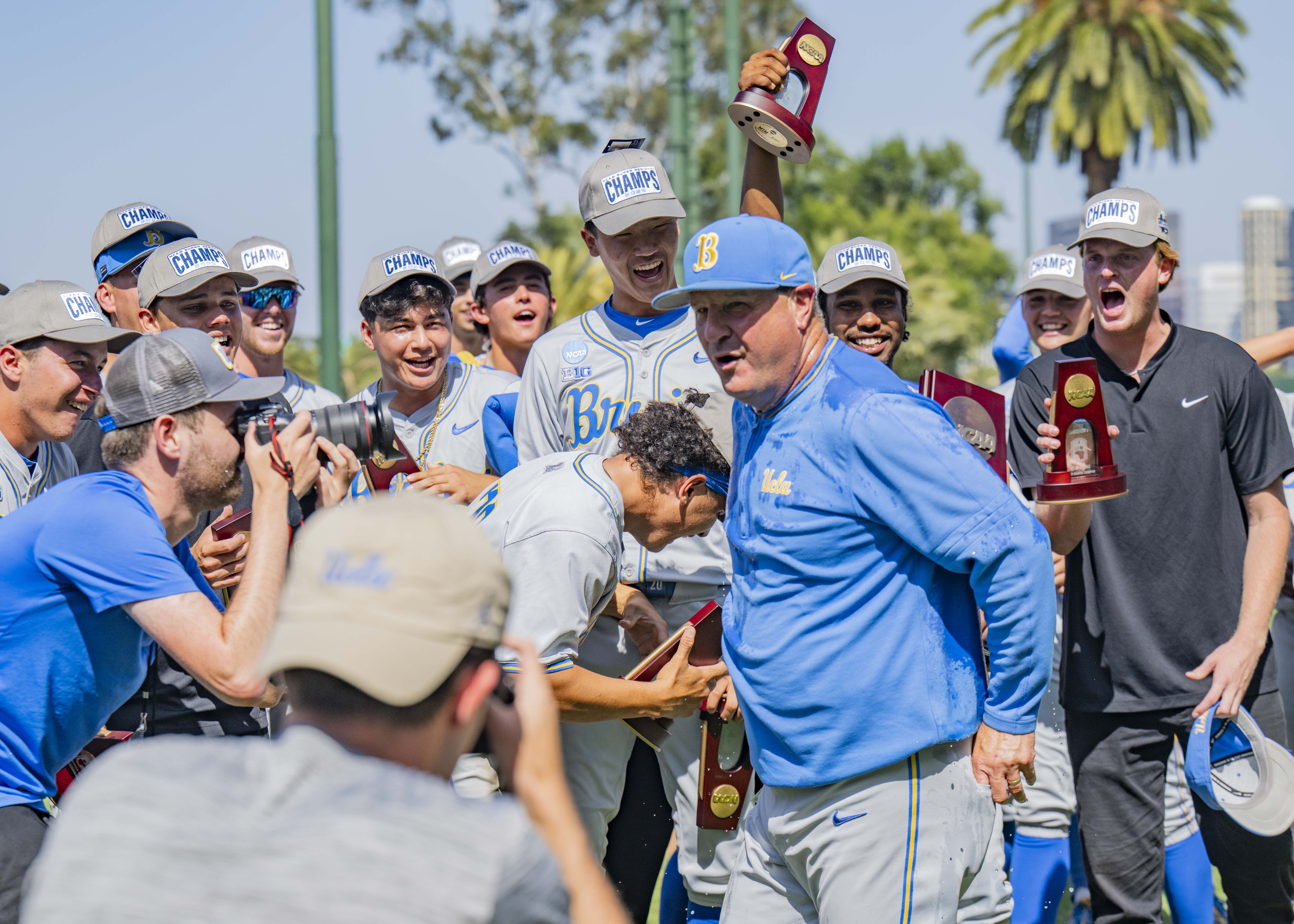 Coach John Savage celebrates with his team after winning the Los Angeles Super Regional. (Aidan Sun/Assistant Photo editor)