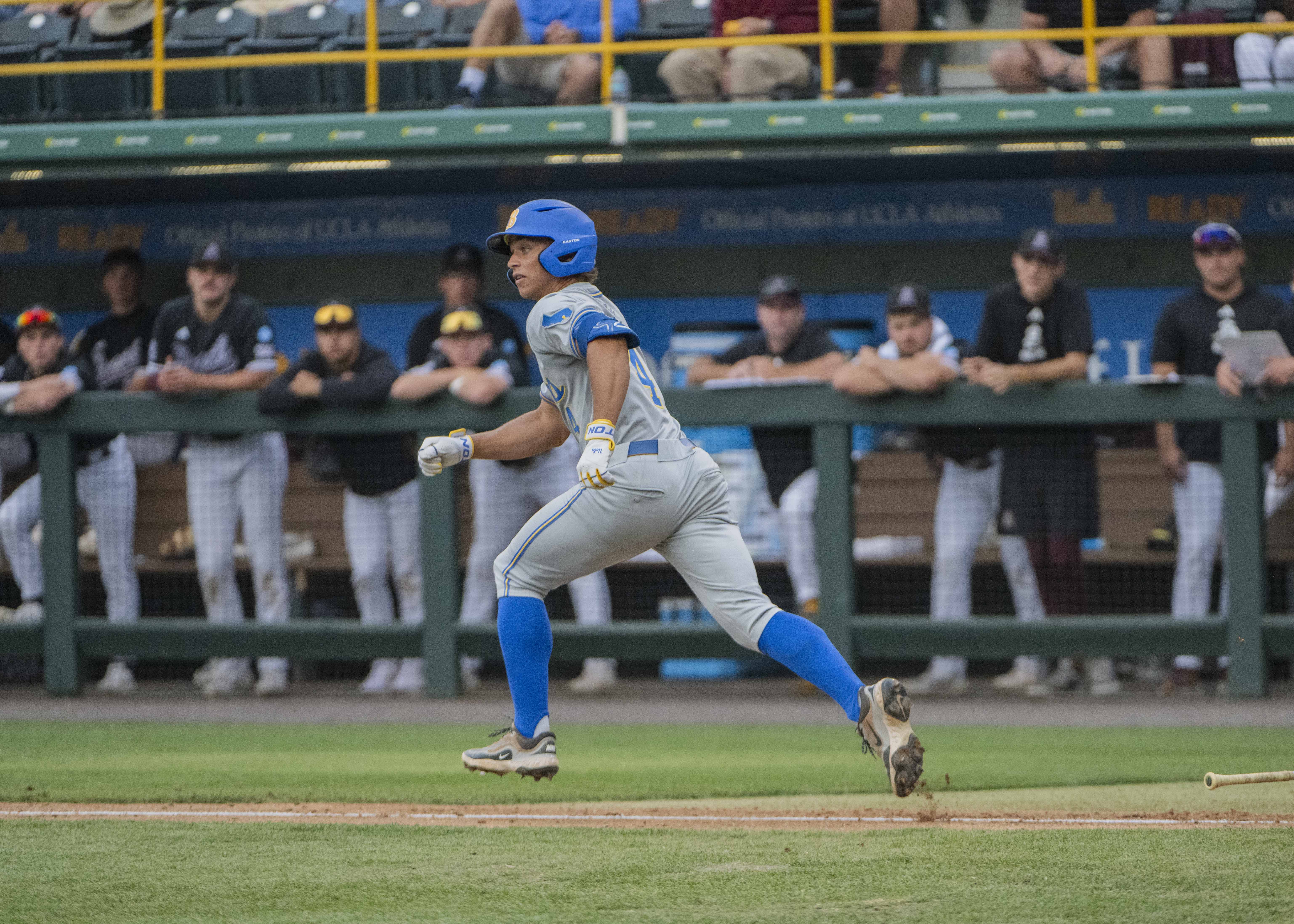 Sophomore second baseman Phoenix Call runs down the first base line. Call caught the final out Sunday. (Brianna Carlson/Daily Bruin staff)