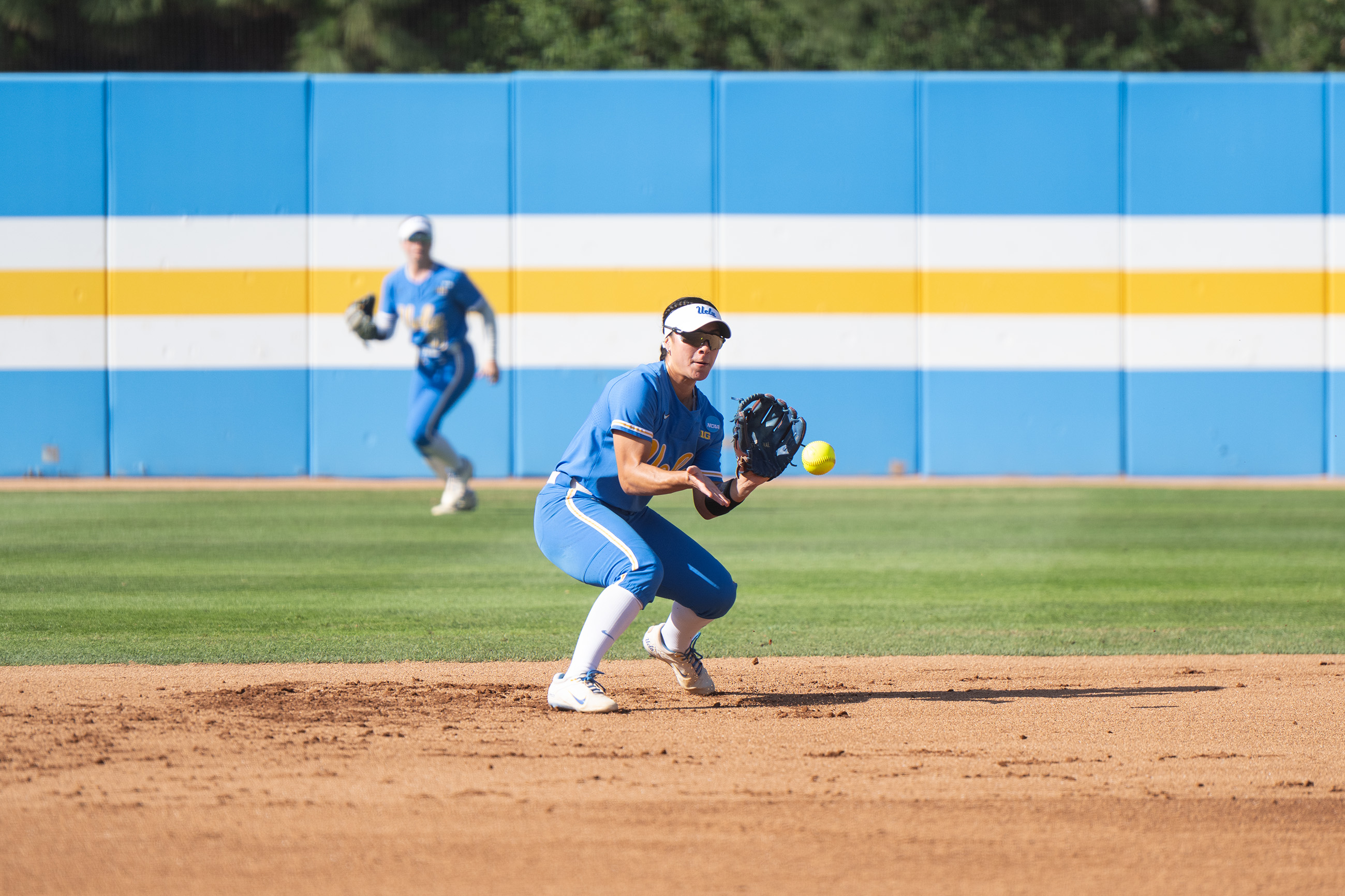 Senior utility Savannah Pola prepares to catch the ball while playing second base at Easton Stadium.