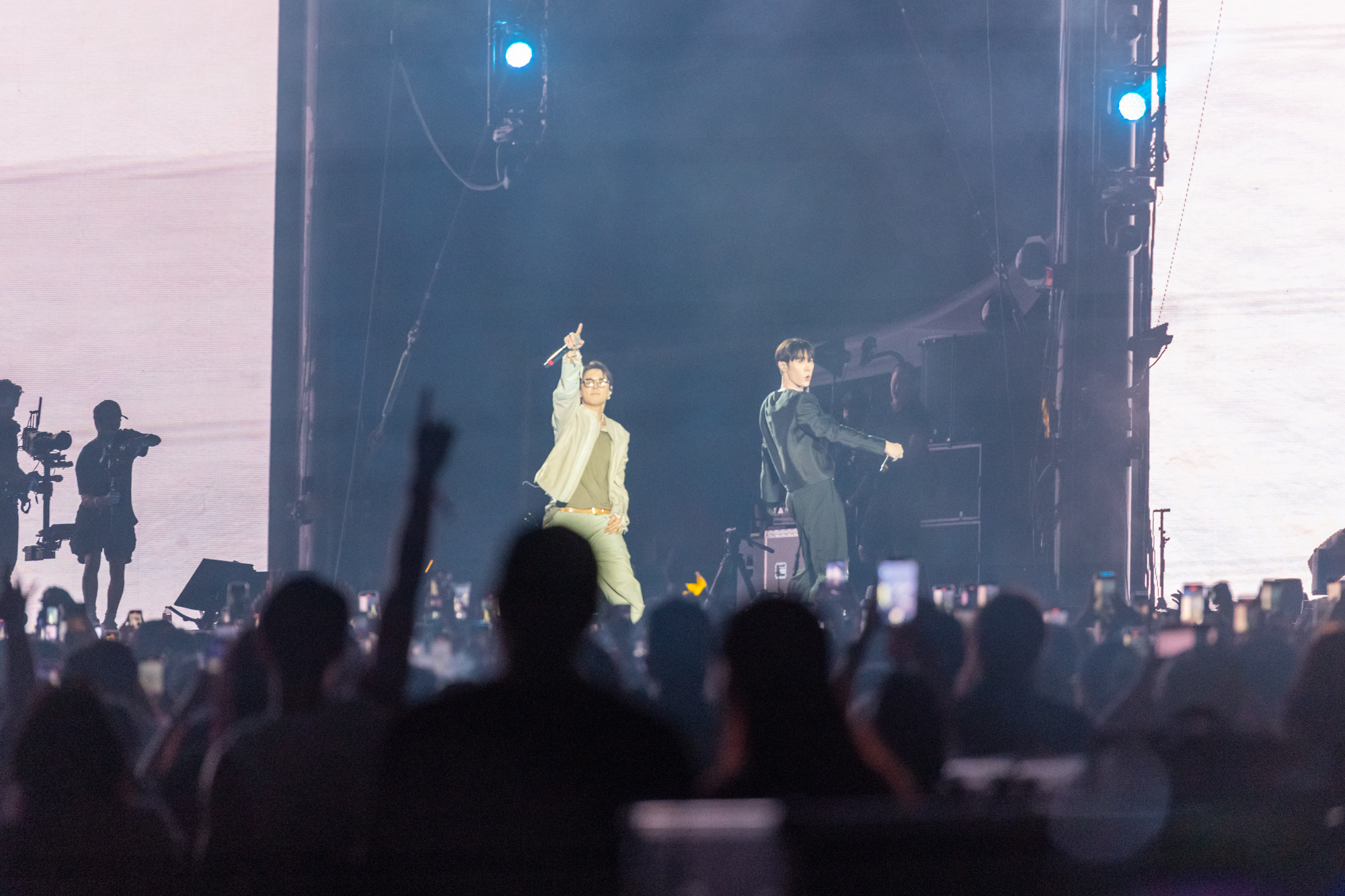 DEAN (left) and Tabber (right) perform together on stage Saturday during the first day of the 2025 Head in the Clouds Music & Arts Festival in Pasadena, California. The two artists&squot; set featured collaborative renditions of tracks such as "007" and "Chi-Ka." (Max Zhang/Daily Bruin)