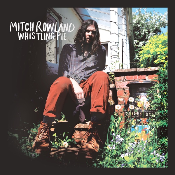 "Whistling Pie" cover art shows Mitch Rowland sitting down surrounded by grass and trees. Rowland&squot;s upcoming album is inspired by living with his kids in the English countryside, furthering the artist&squot;s folk sound. (Courtesy of Erskine Records/Giant Music)