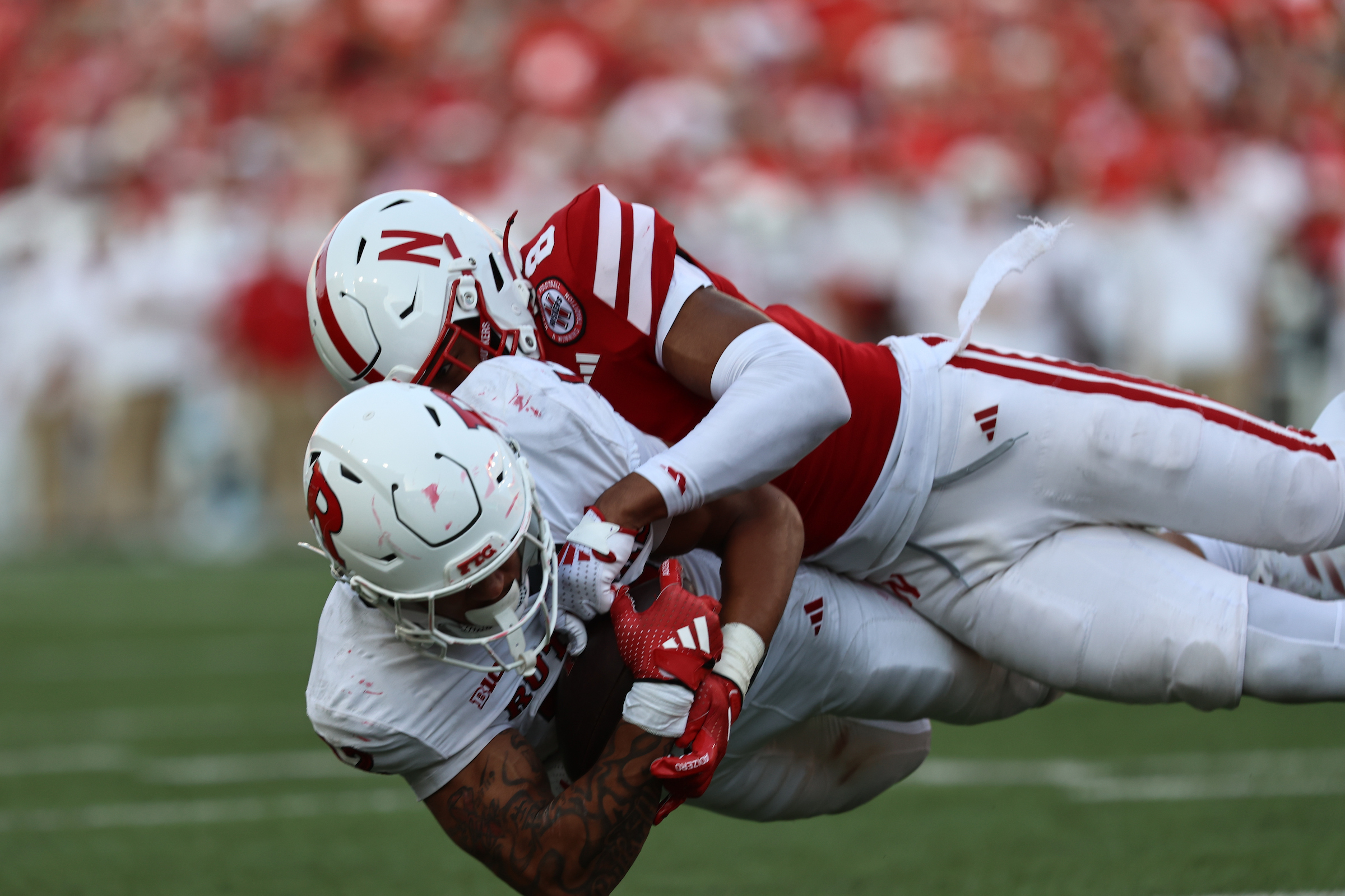 Defensive back DeShon Singleton tackles a Rutgers player. (Courtesy of Nebraska Athletics)