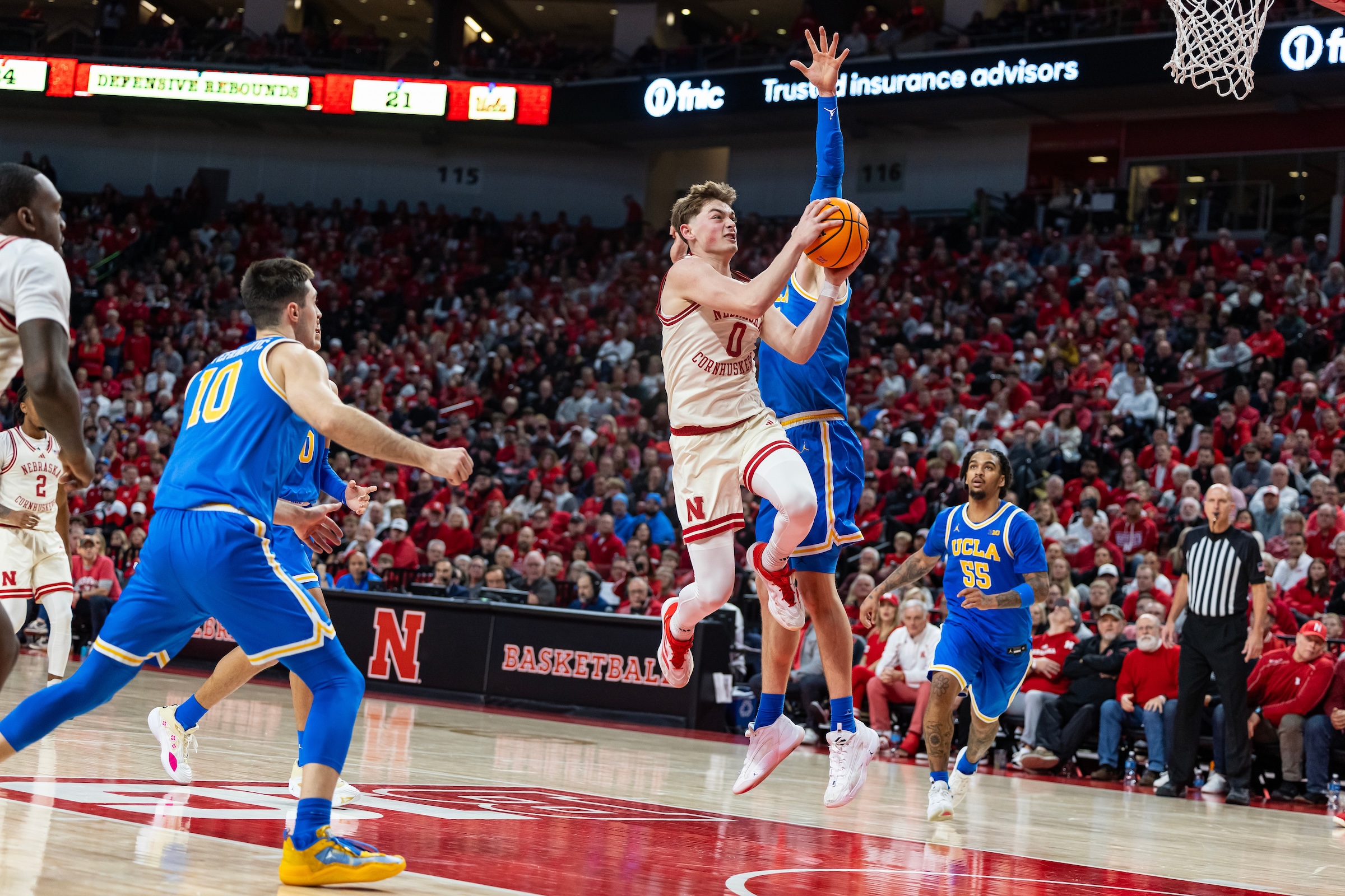 Guard Connor Essegian goes up for a shot while a UCLA player guards him. (Courtesy of Nebraska Athletics)