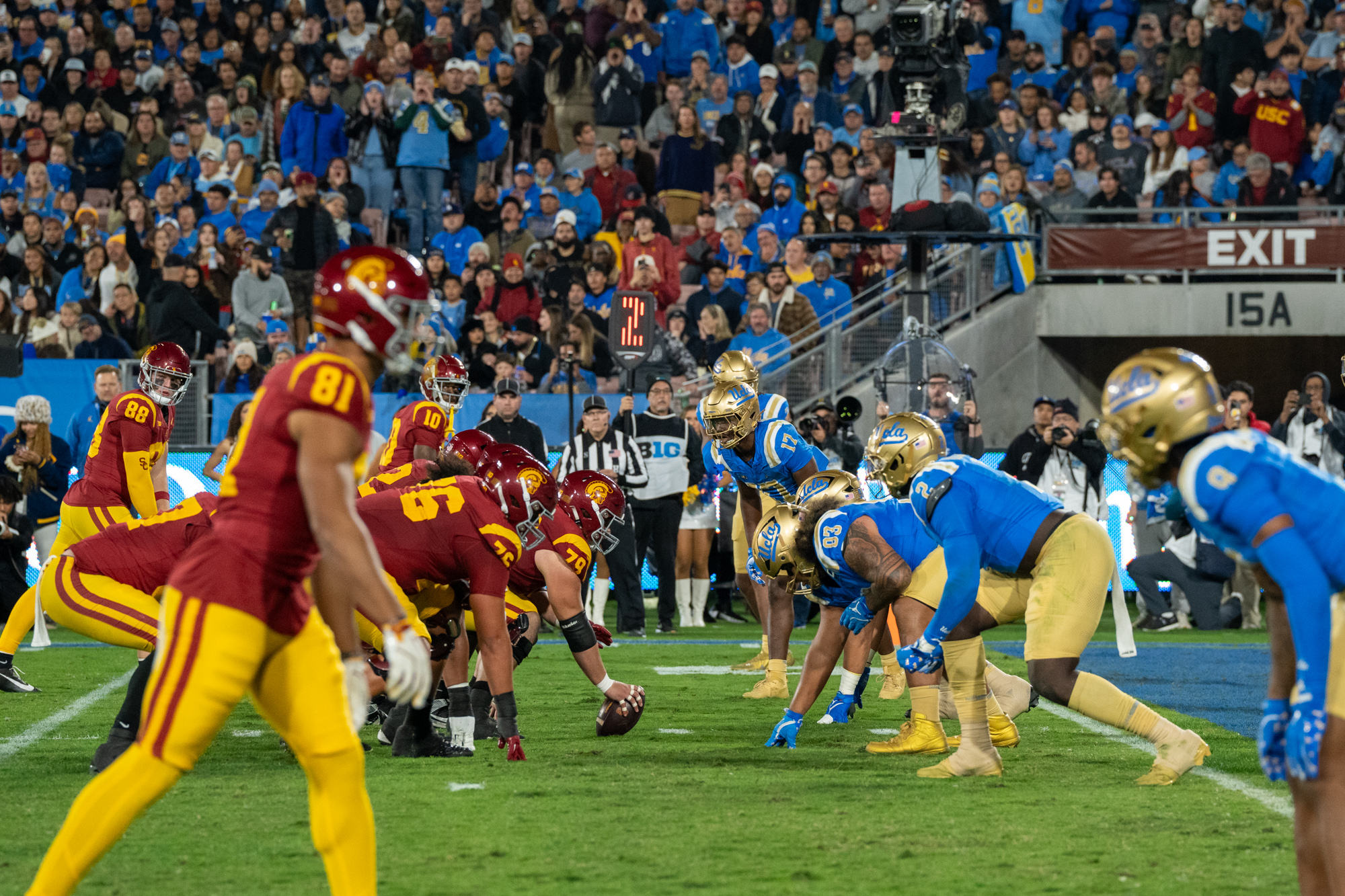 UCLA and USC football line up at the line of scrimmage at UCLA's own two-yard line. The Trojans boast more wins than the Bruins in the rivalry's football history, holding a 51-34-7 record. The Bruins fell to the Trojans in last year's football contest, losing 13-19 at the Rose Bowl.