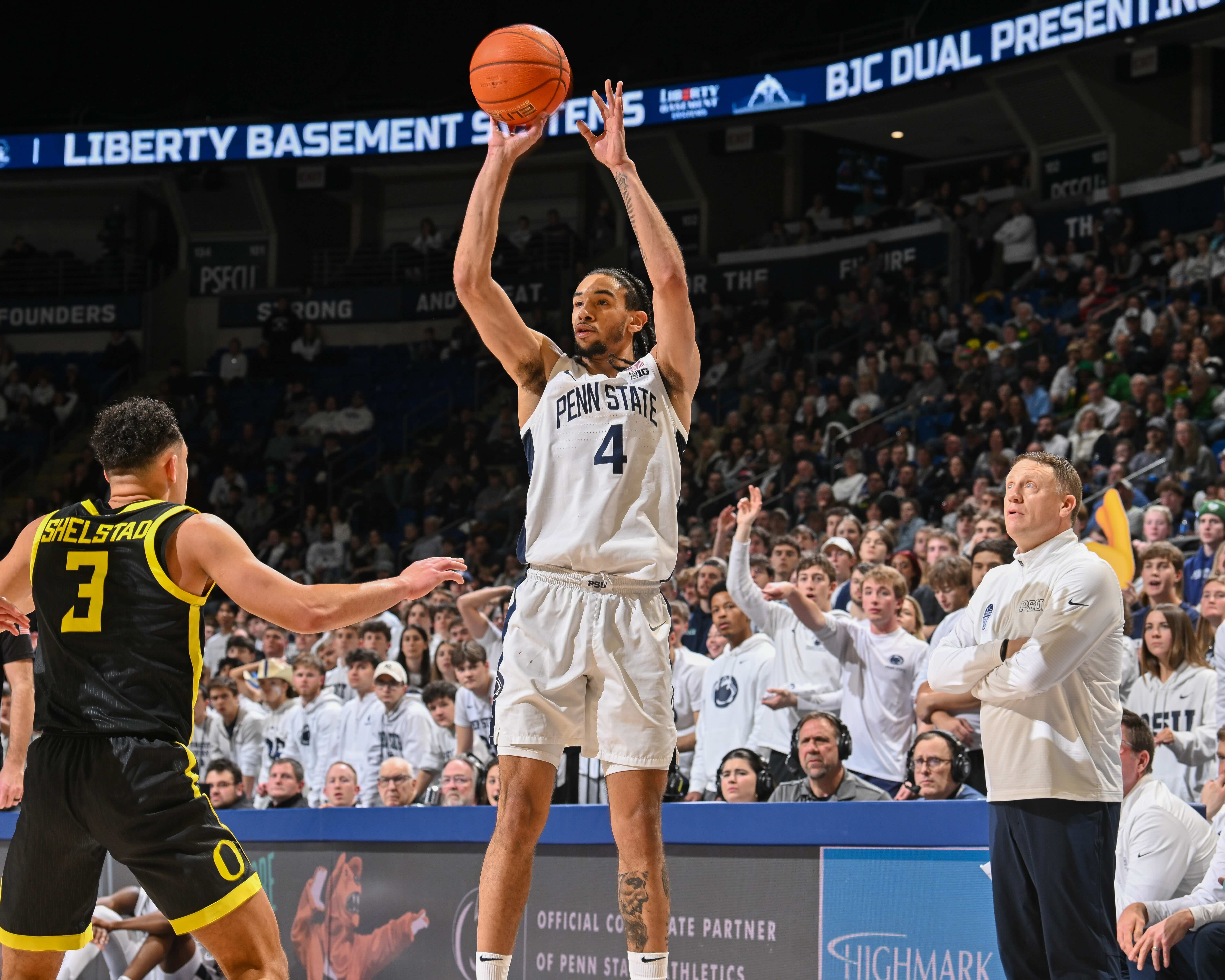 Guard Freddie Dilione V begins to shoot the ball. Dilione averaged 9.4 points per game last season. (Courtesy of Penn State Athletics)