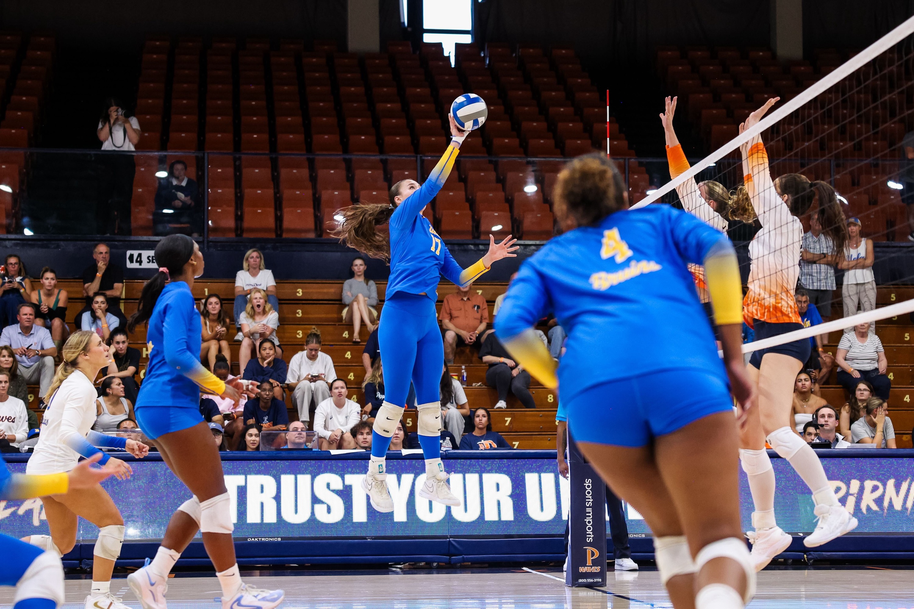 Freshman outside hitter Eliana Urzua goes to tip a ball over the block. (Courtesy of UCLA Athletics)