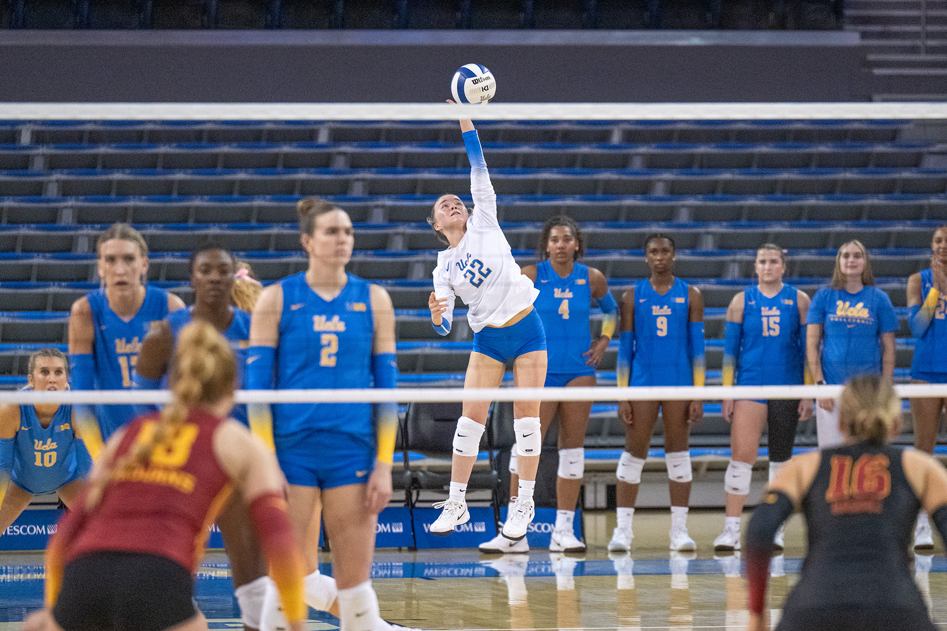 Junior defensive specialist/libero Kat Lutz serves the ball. (Kai Dizon/Daily Bruin senior staff)