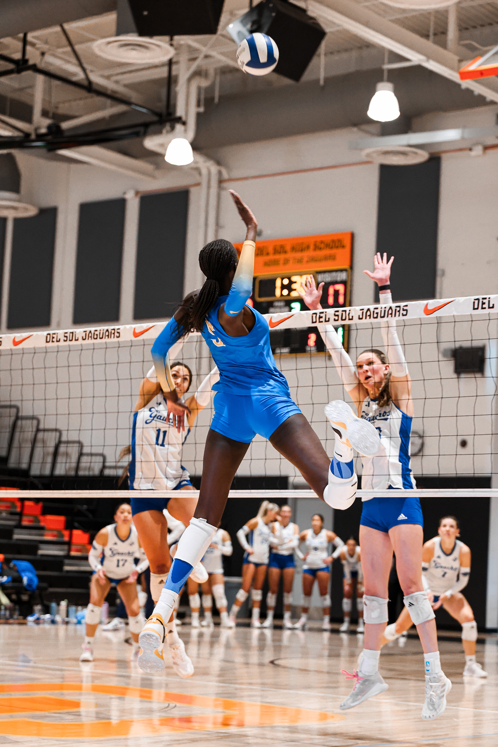 Graduate student middle blocker Phekran Kong begins her approach to hit the ball. (Courtesy of UCLA Athletics)