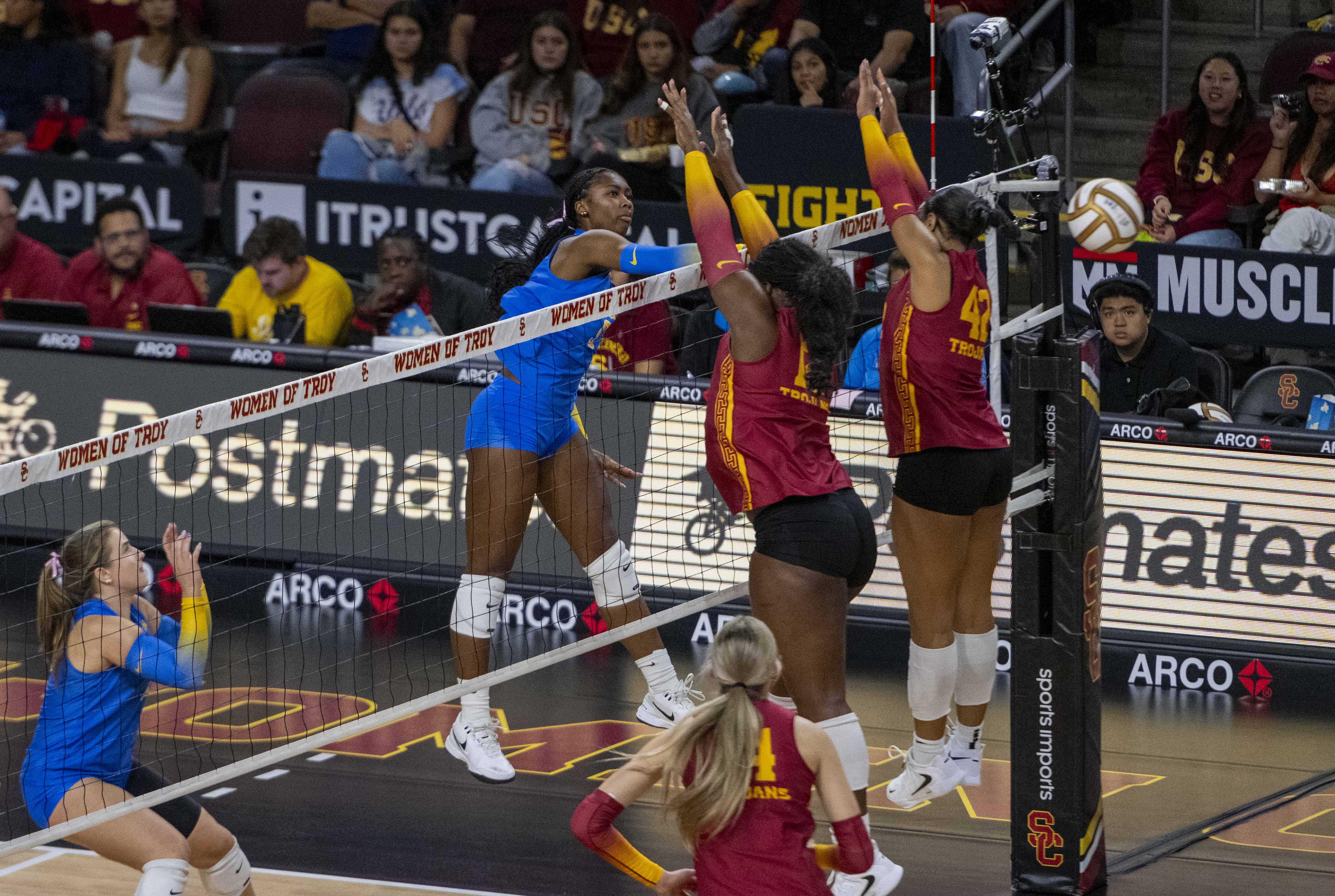 Senior outside hitter Cheridyn Leverette hits a ball through the block. (Zimo Li/Daily Bruin senior staff)
