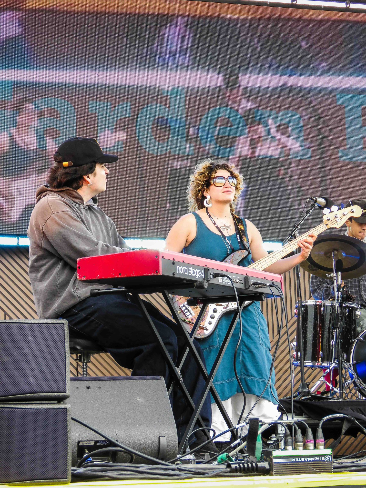 Pictured are two members of the band performing at Shabang Music Festival in San Luis Obispo. Playing the same stage as headlining band Wallows, bassist Sara Gorman said Garden Party's set was entirely made of original songs. (Courtesy of Jonathan Ortega, Cocona Mori)