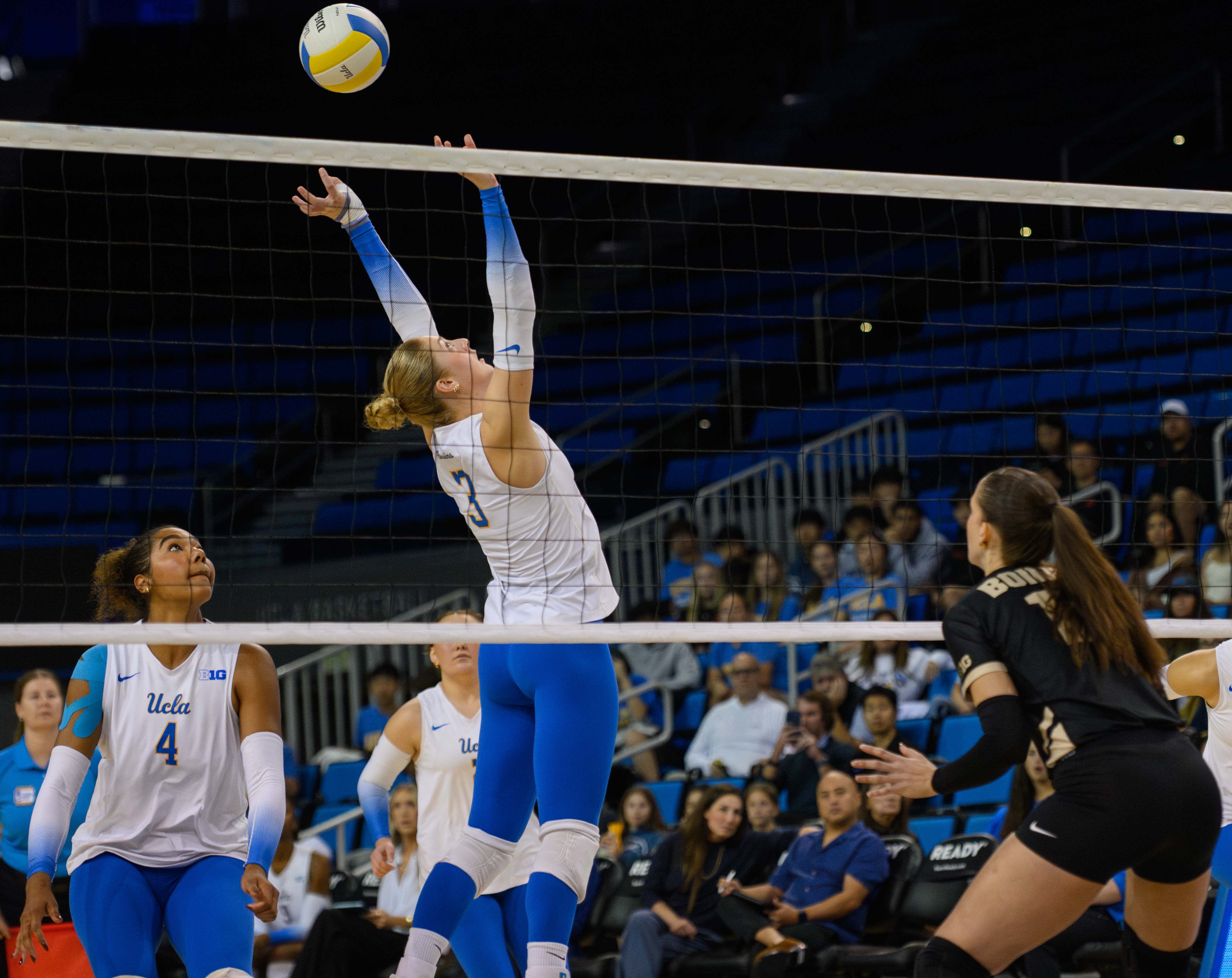 Sophomore setter Kate Duffey jumps and back sets the ball to her teammate. (Zimo Li/Daily Bruin senior staff)