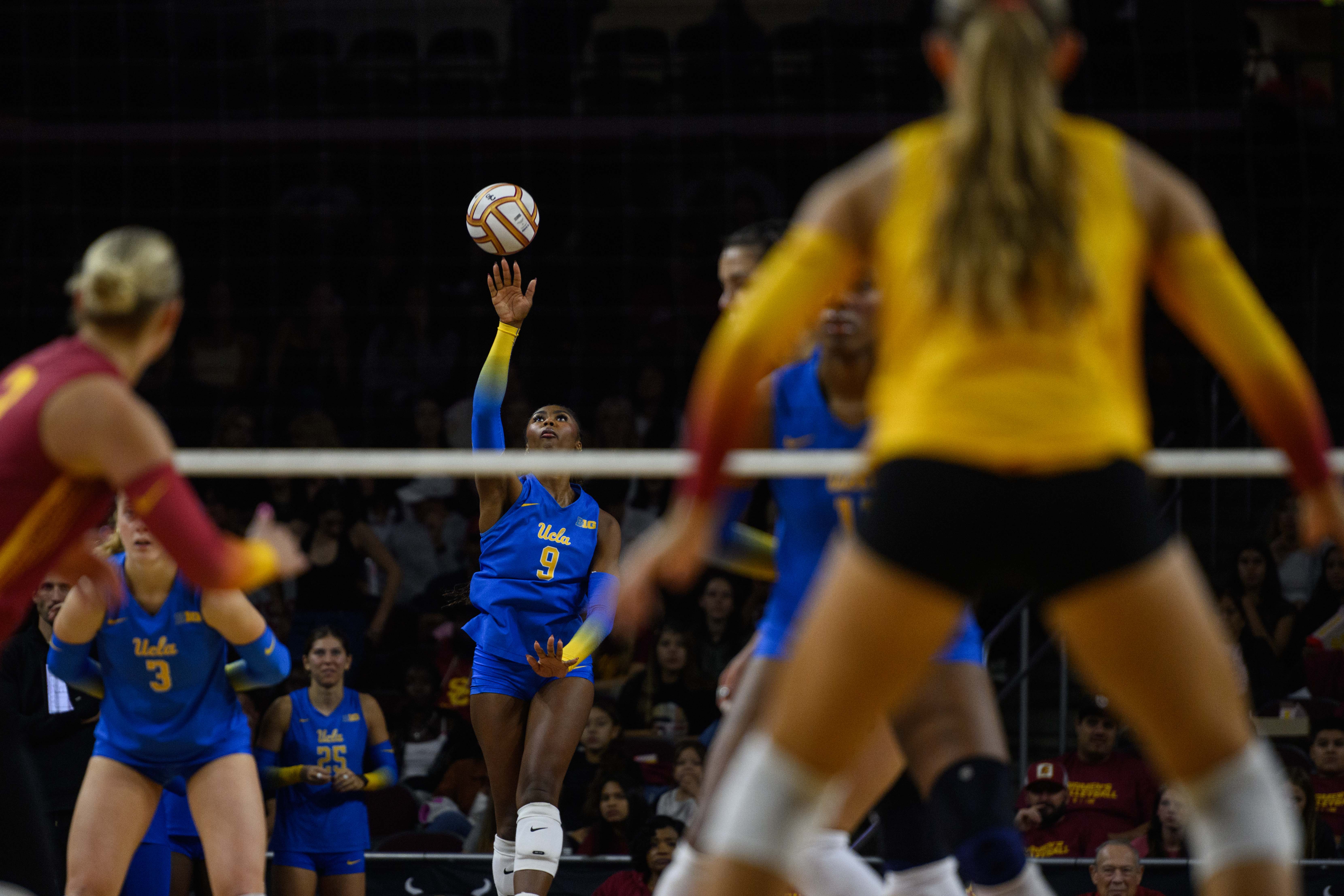 Senior outside hitter Cheridyn Leverette serves the ball. (Libby Li/Daily Bruin)
