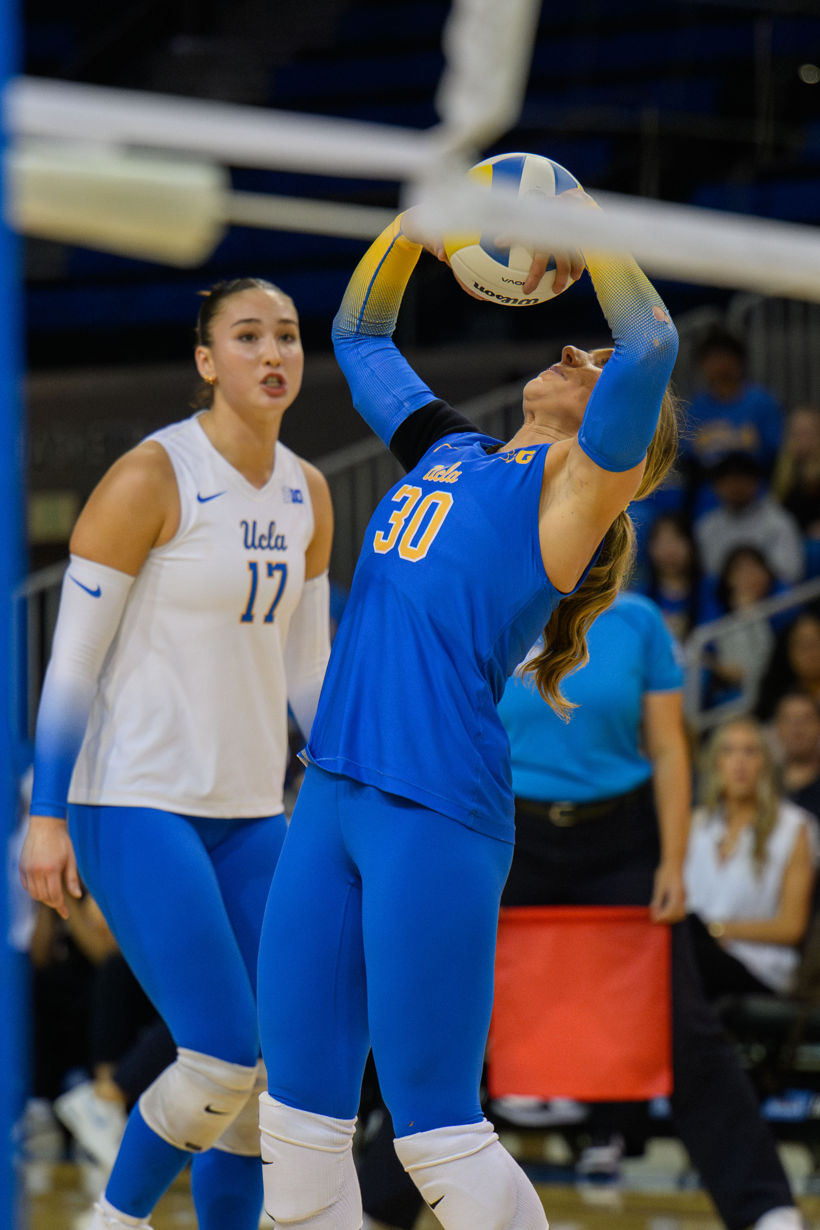 Sophomore libero Lola Schumacher takes the second touch and back sets the ball to her teammate. (Andrew Diaz/Photo editor)