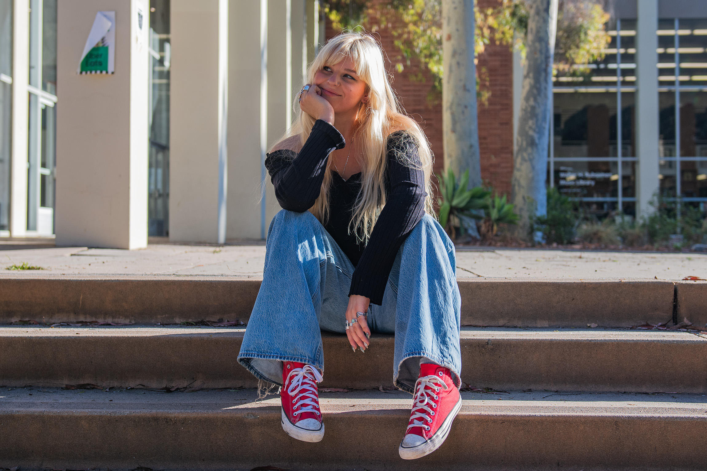 Fleming sits on the steps of Schoenberg Hall. Paix Auslander, a fourth-year musicology student, said Fleming's stage presence combines both strength and emotion, creating a comfortable environment for her audience. (Brianna Carlson/Daily Bruin staff)