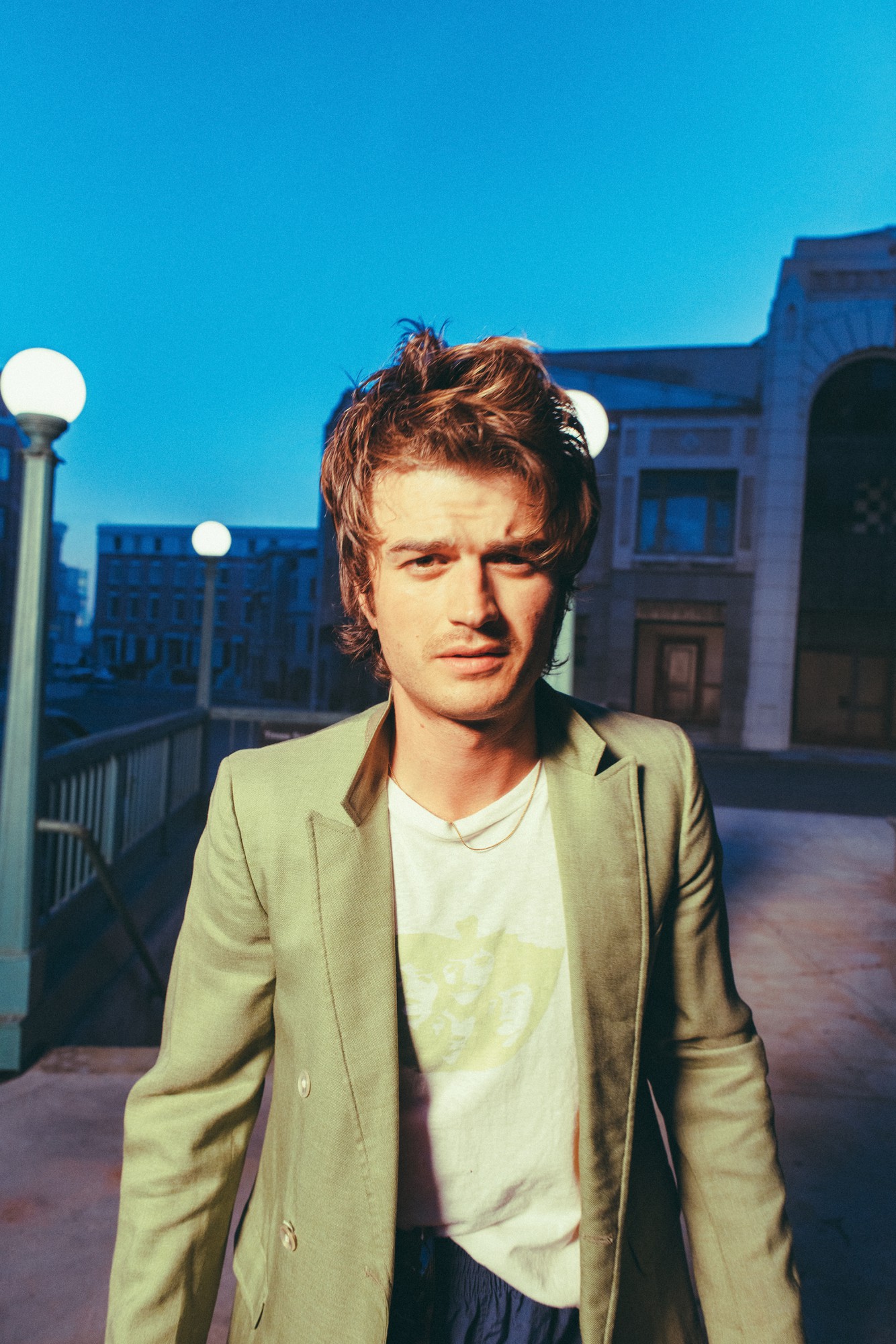 Pictured is Joe Keery (Djo) wearing a green blazer. As part of the “Another Bite Tour,” the actor and singer is making a stop at the Greek Theatre on Oct. 20 and 21. (Courtesy of Neil Krug, Grandstand Media)
