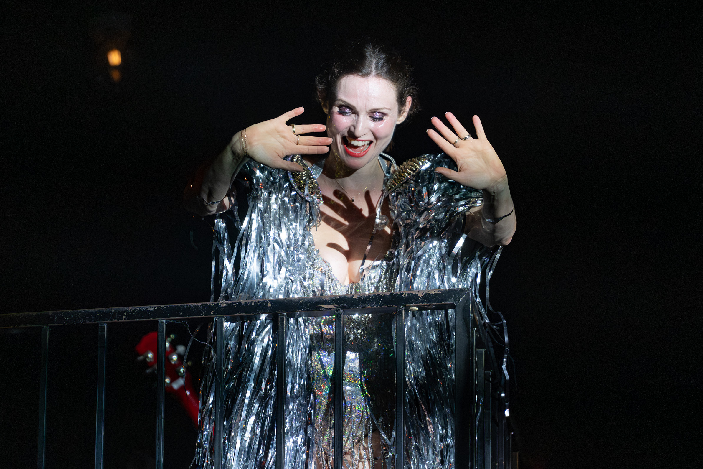 Sophie Ellis-Bextor waves to the crowd below her while standing on a balcony at The Regent Theater on Oct. 27. The singer-songwriter closed her setlist of dance tracks by performing her song "Don&squot;t Know What You&squot;ve Got Until It&squot;s Gone" from the balcony, accompanied solely by an acoustic guitar. (Selin Filiz/Assistant Photo editor)