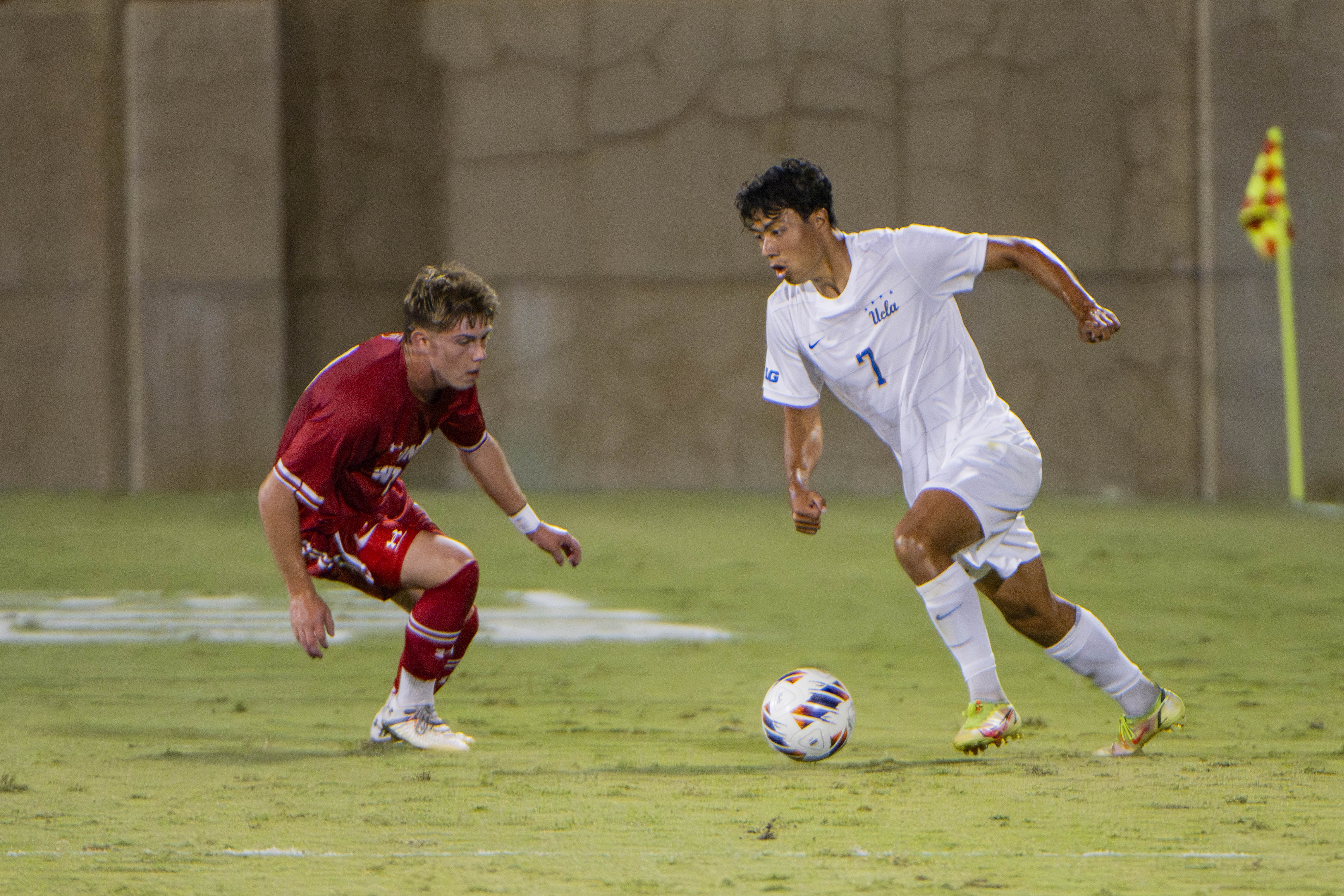 Junior midfielder Philip Naef dribbles towards an opponent. (Andrew Ramiro Diaz/Photo editor)