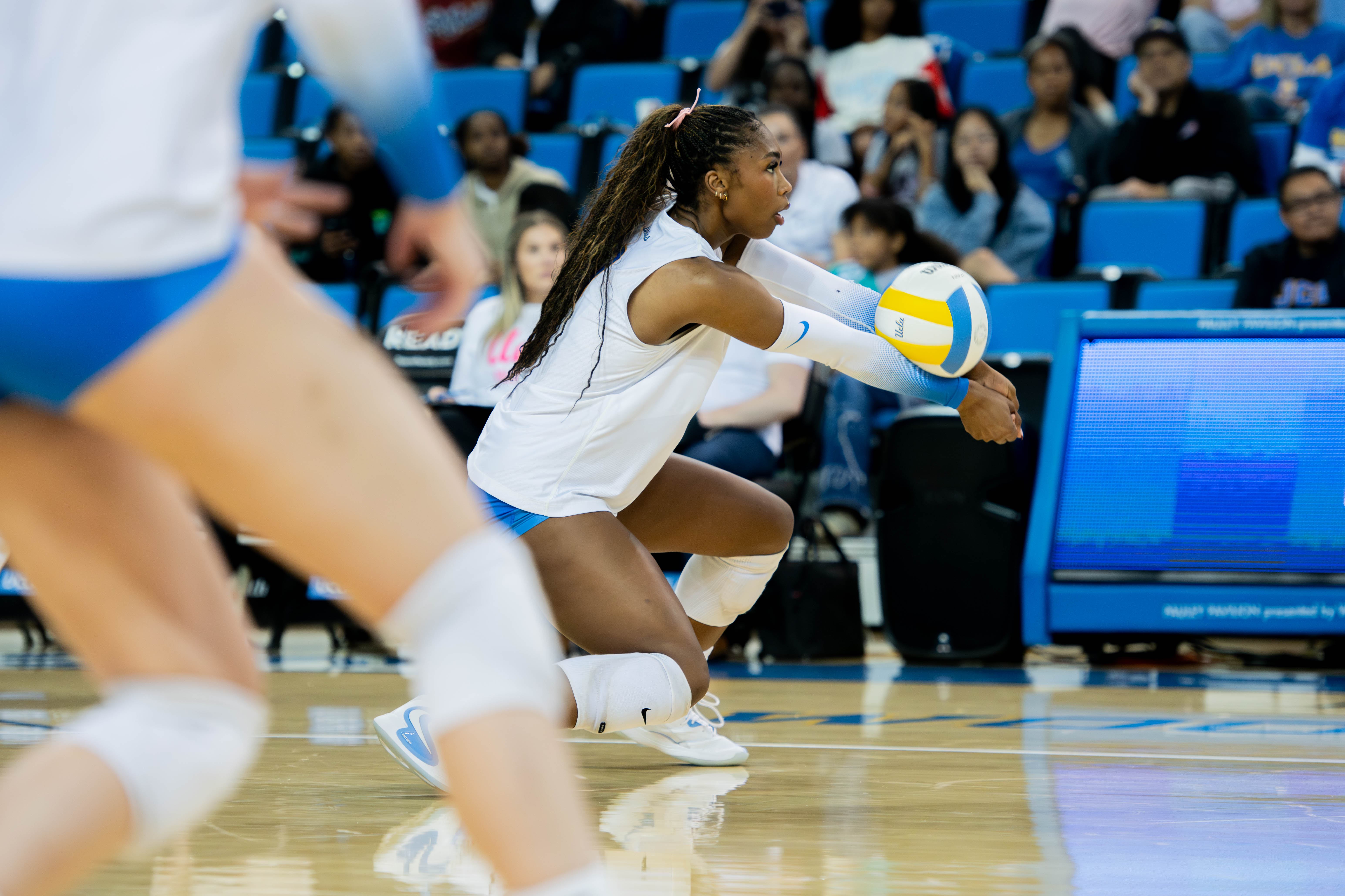 Senior outside hitter Cheridyn Levrette receives the ball and makes the pass out of the back row.(Edward Ho/Daily Bruin)