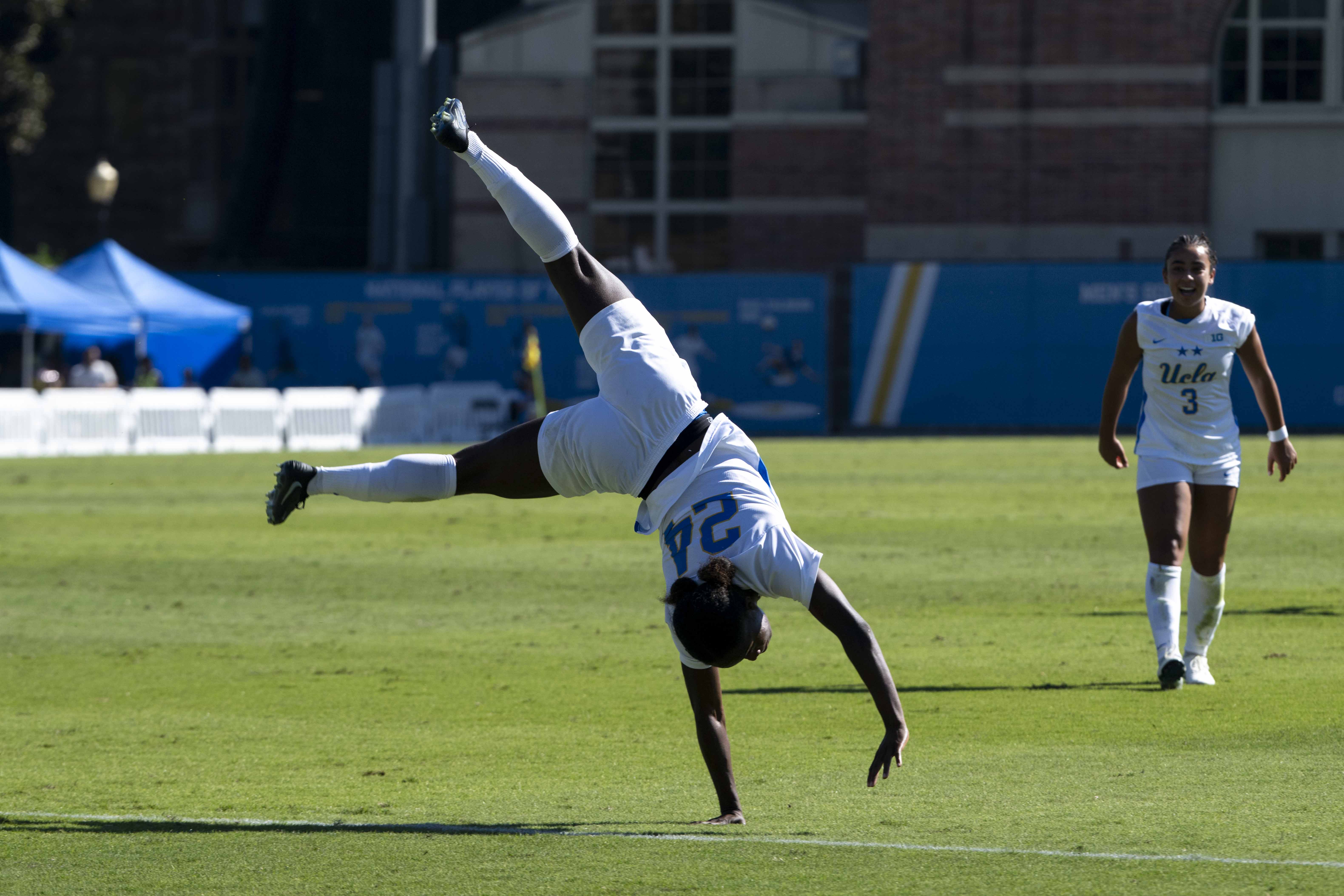 Freshman forward Payten Cooper cartwheels in celebration after scoring her second goal of the season. (Leydi Cris Cobo Cordon/Daily Bruin senior staff)