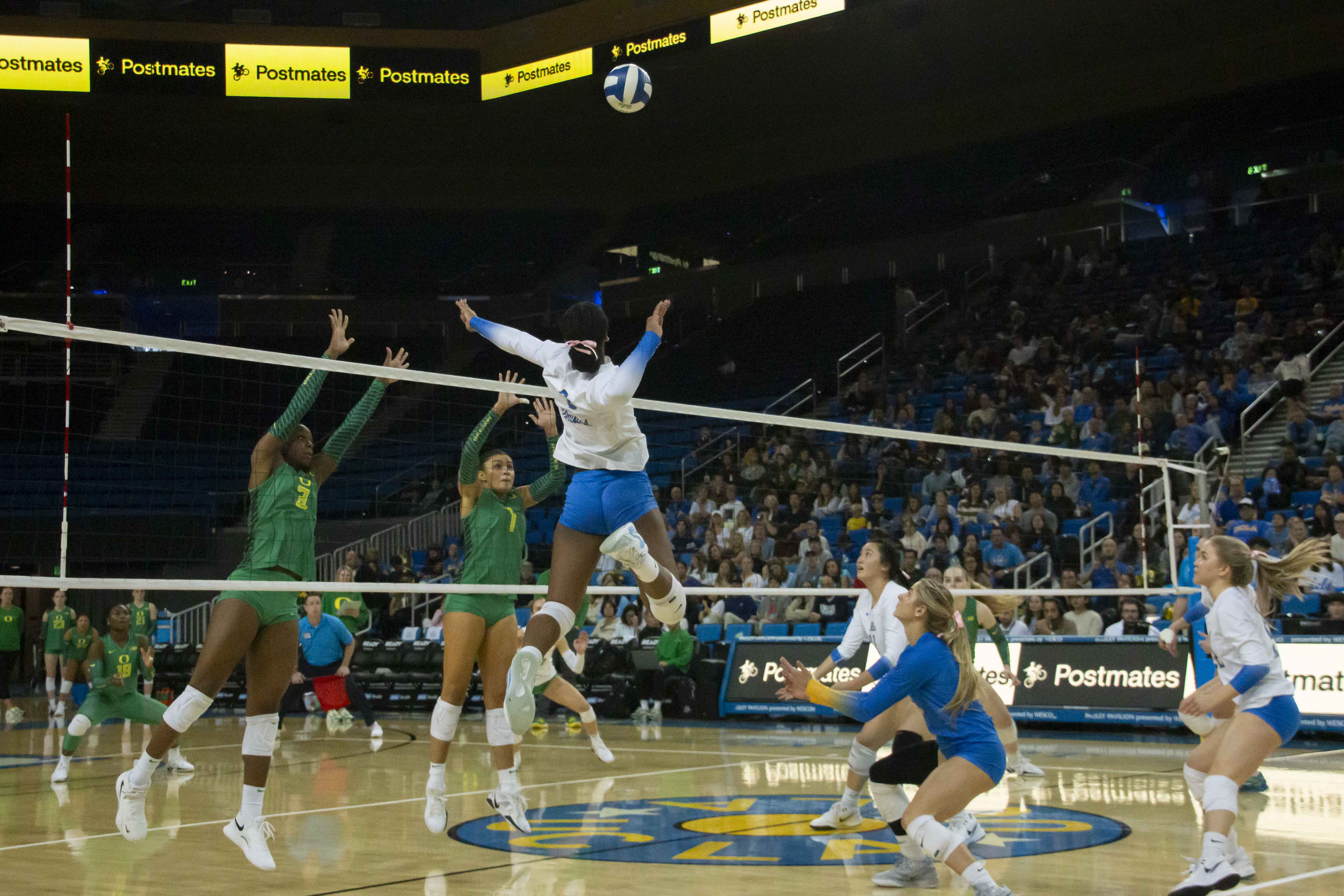 Senior outside hitter Cheridyn Leverette goes up to hit the ball. (Max Zhang/Daily Bruin staff)
