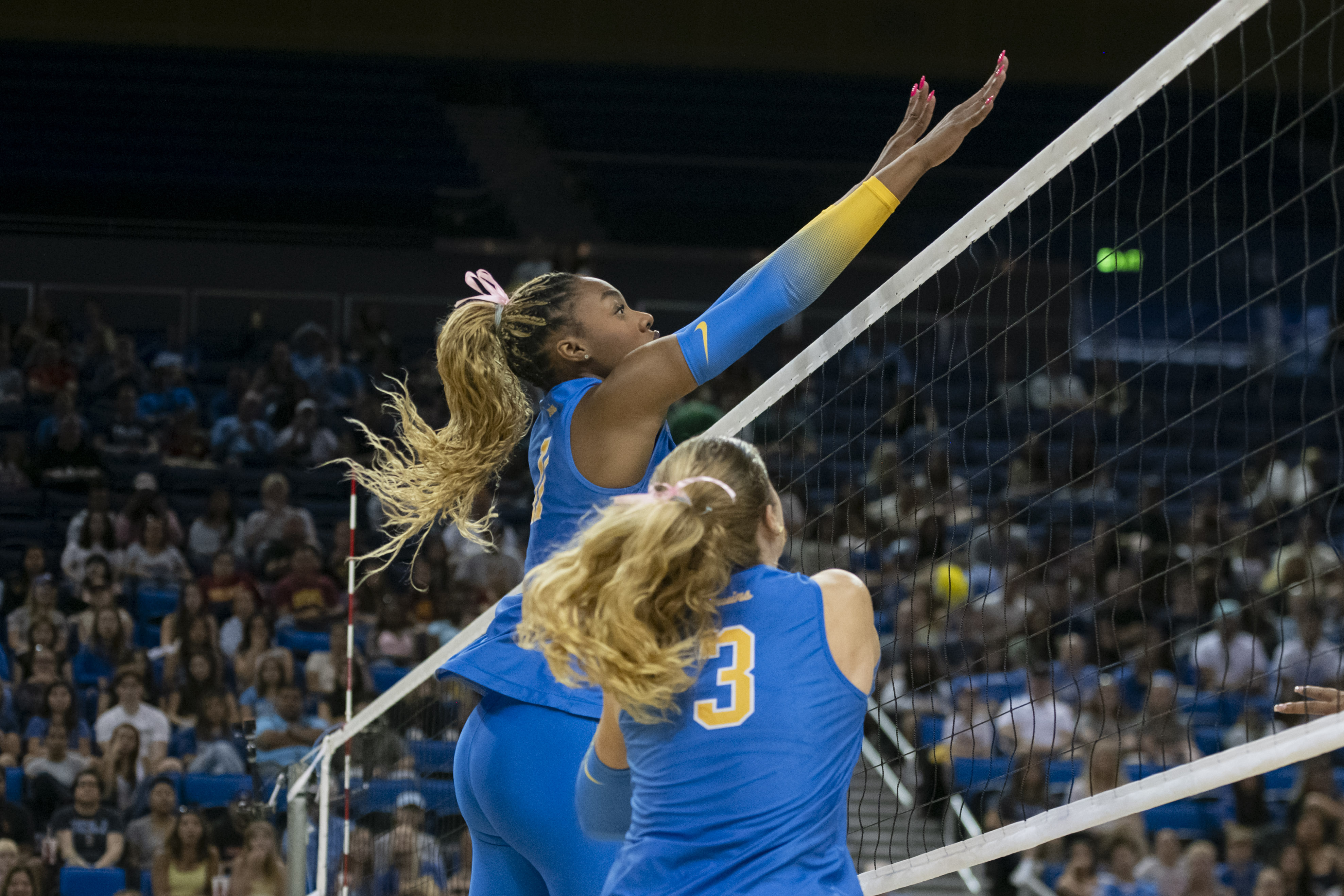 Redshirt junior middle blocker Marianna Singletary goes up for a block. Singletary is currently tied for first in blocks in the Big Ten. (Libby Li/Daily Bruin)
