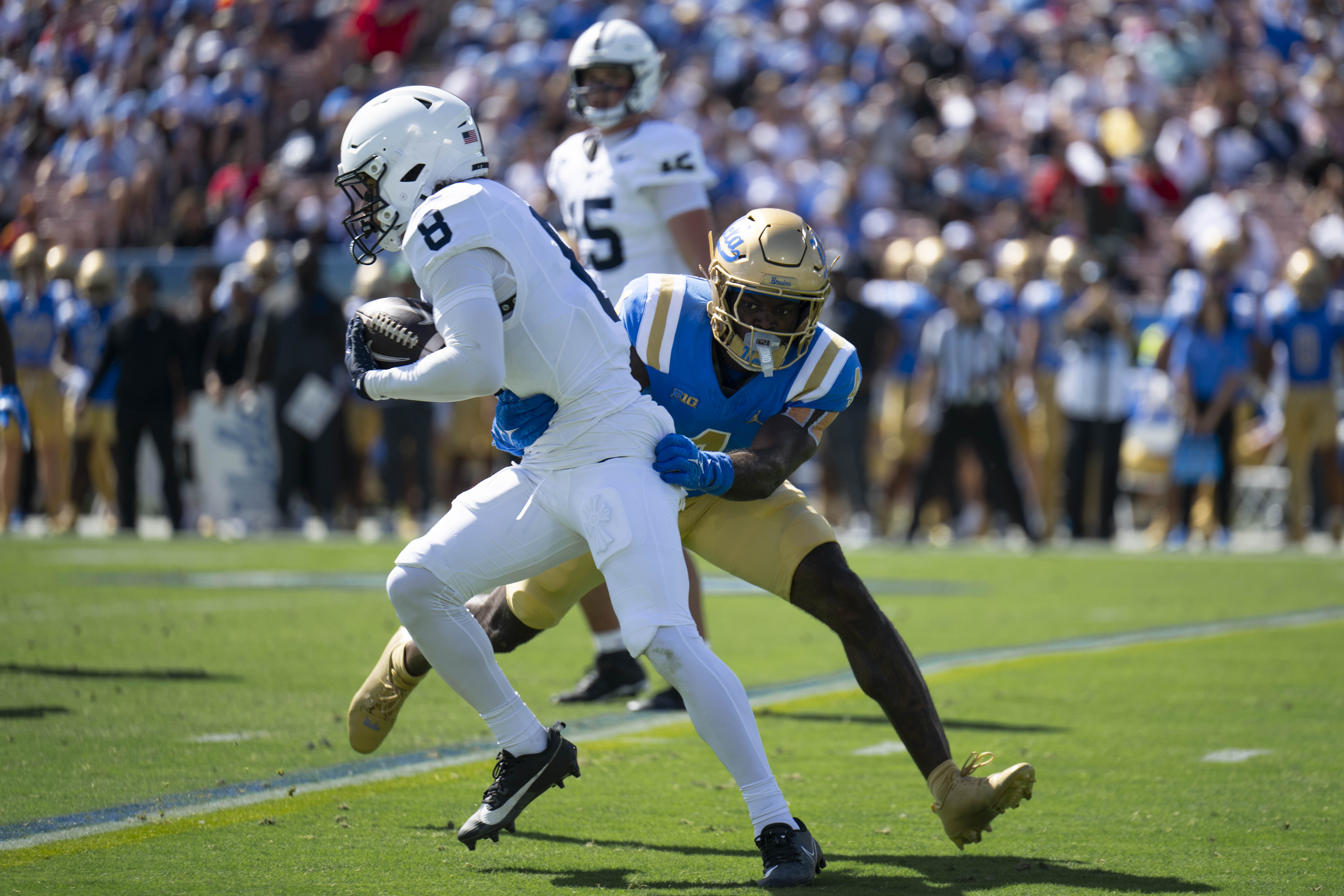 Redshirt senior defensive back Key Lawrence tackles Penn State wide receiver Trebor Peña. (Aidan Sun/Assistant Photo editor)