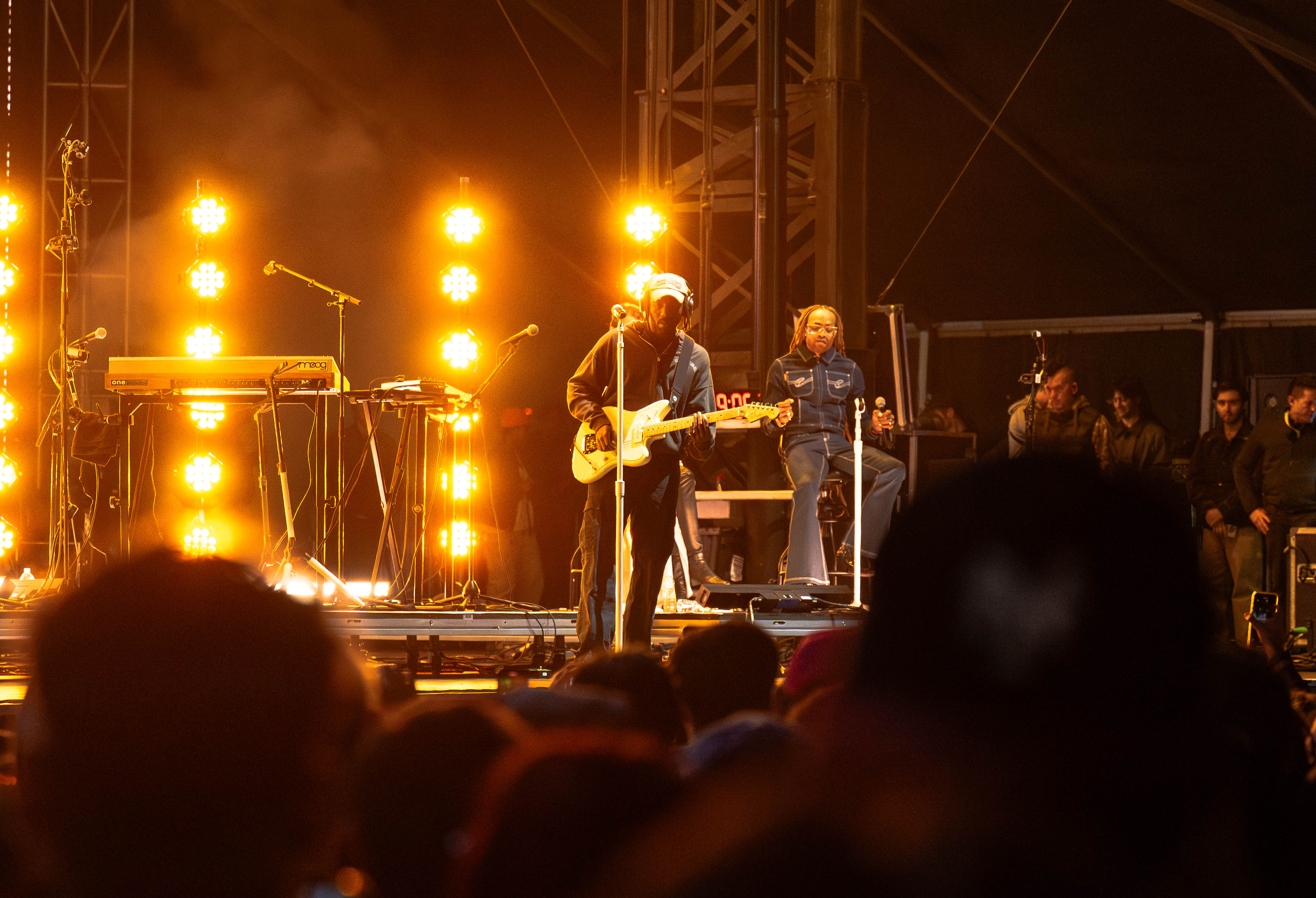 Pictured holding a guitar is Dev Hynes, the artist behind Blood Orange. True to the nature of Blood Orange, the performance was highly collaborative, spotlighting all band members on stage. (Darlene Sanzon/Daily Bruin senior staff)